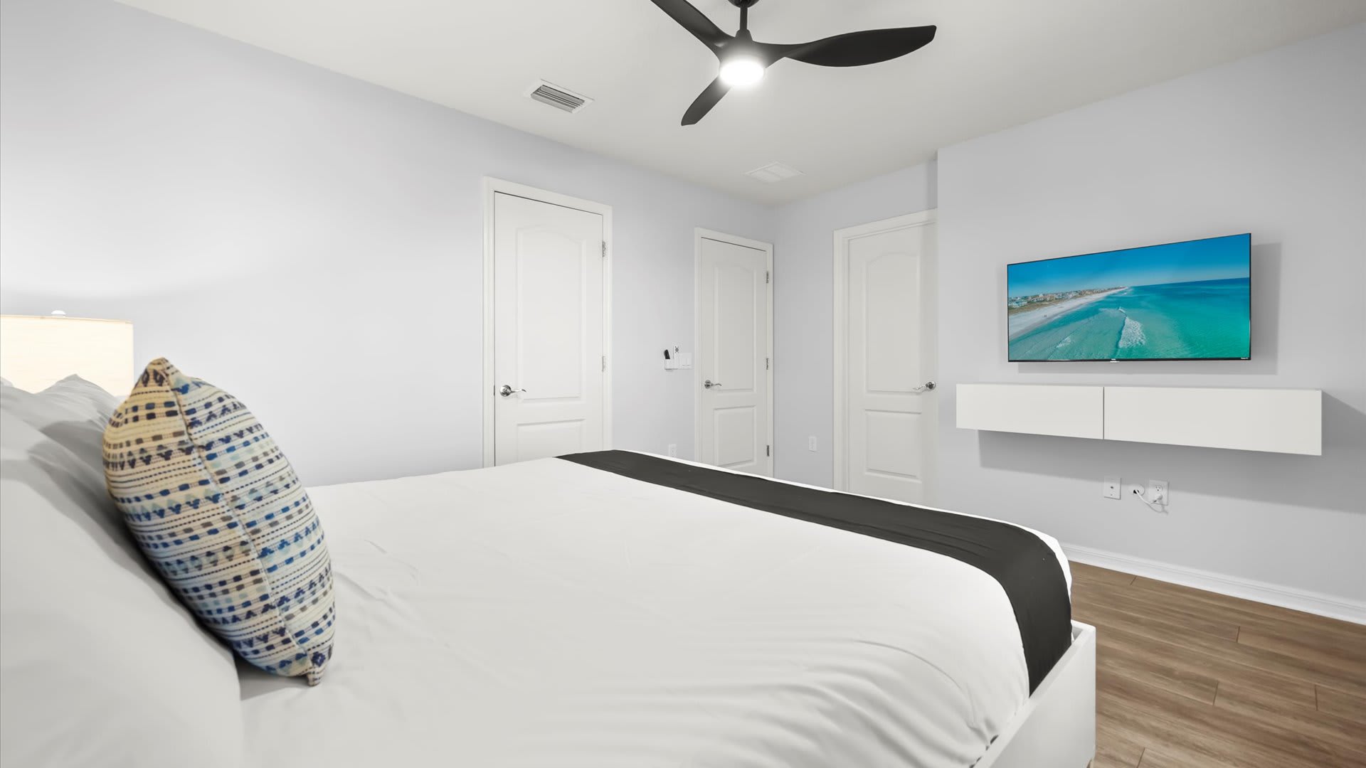 King Bedroom Retreat – A peaceful space with a smart TV, en-suite bathroom, soft linens and calming accents.