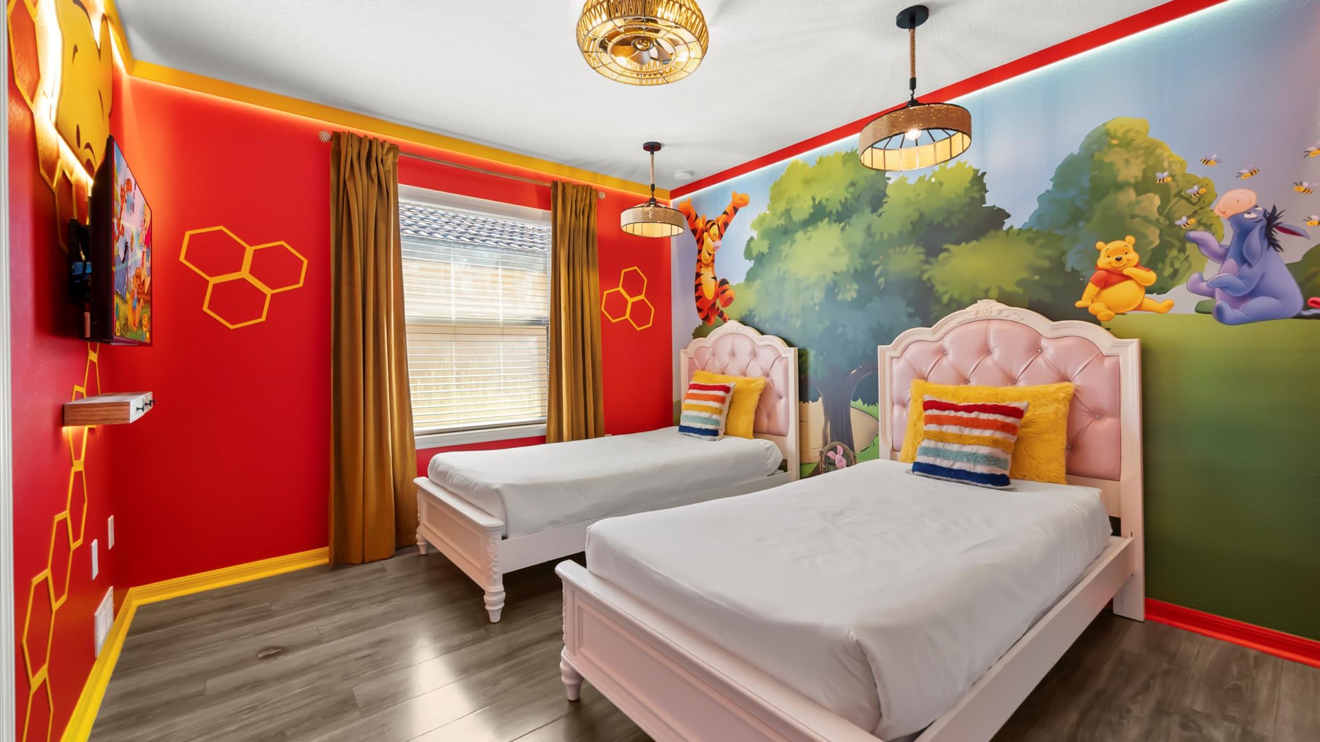 Winnie the Pooh themed twin bedroom with a smart TV perfect for kids.