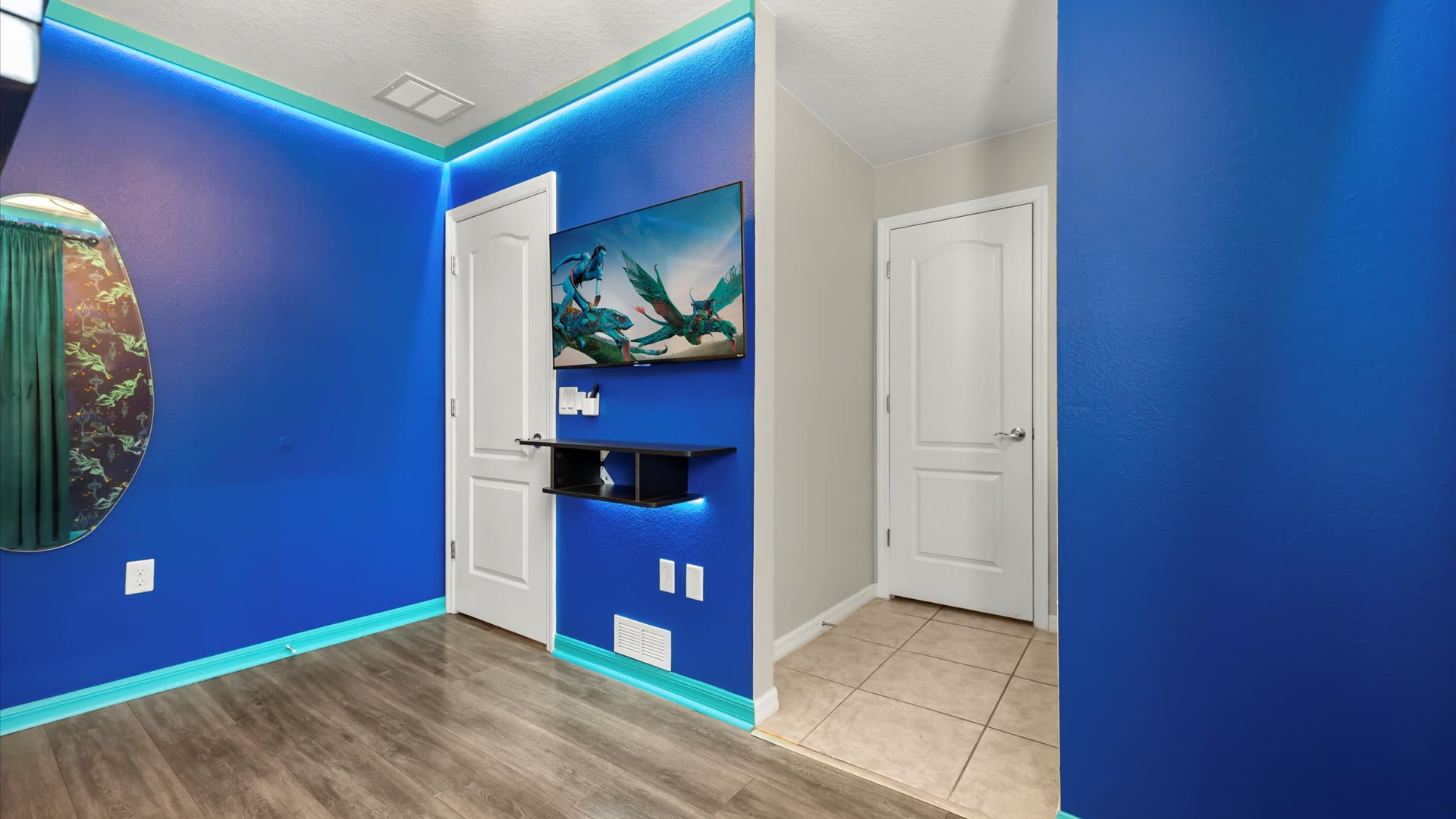 Underwater Mermaid-Themed Bedroom – Magical murals, a smart TV and a bunk bed for dreamers.