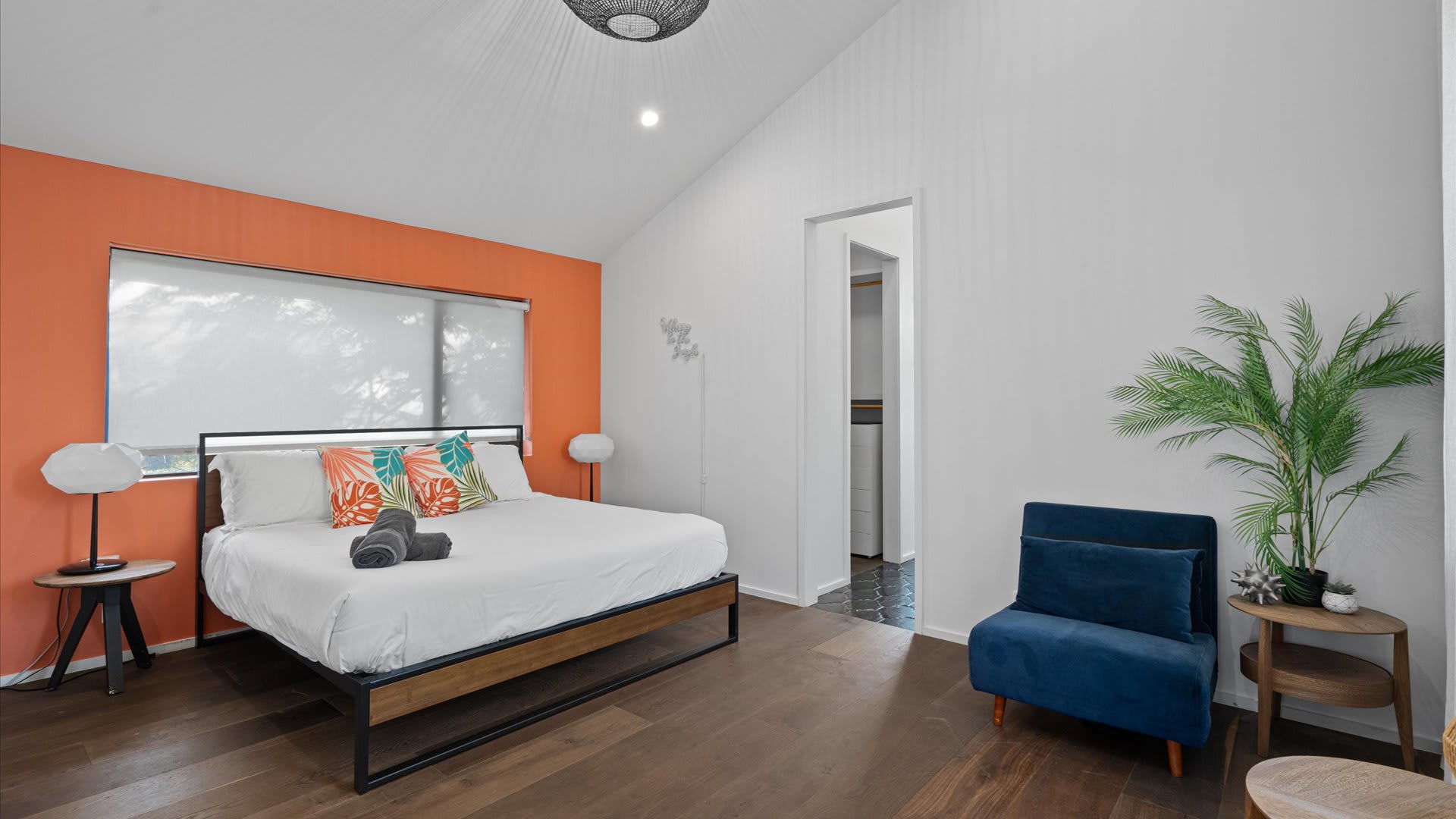 Vibrant Bedroom With A King Bed And Serene Views