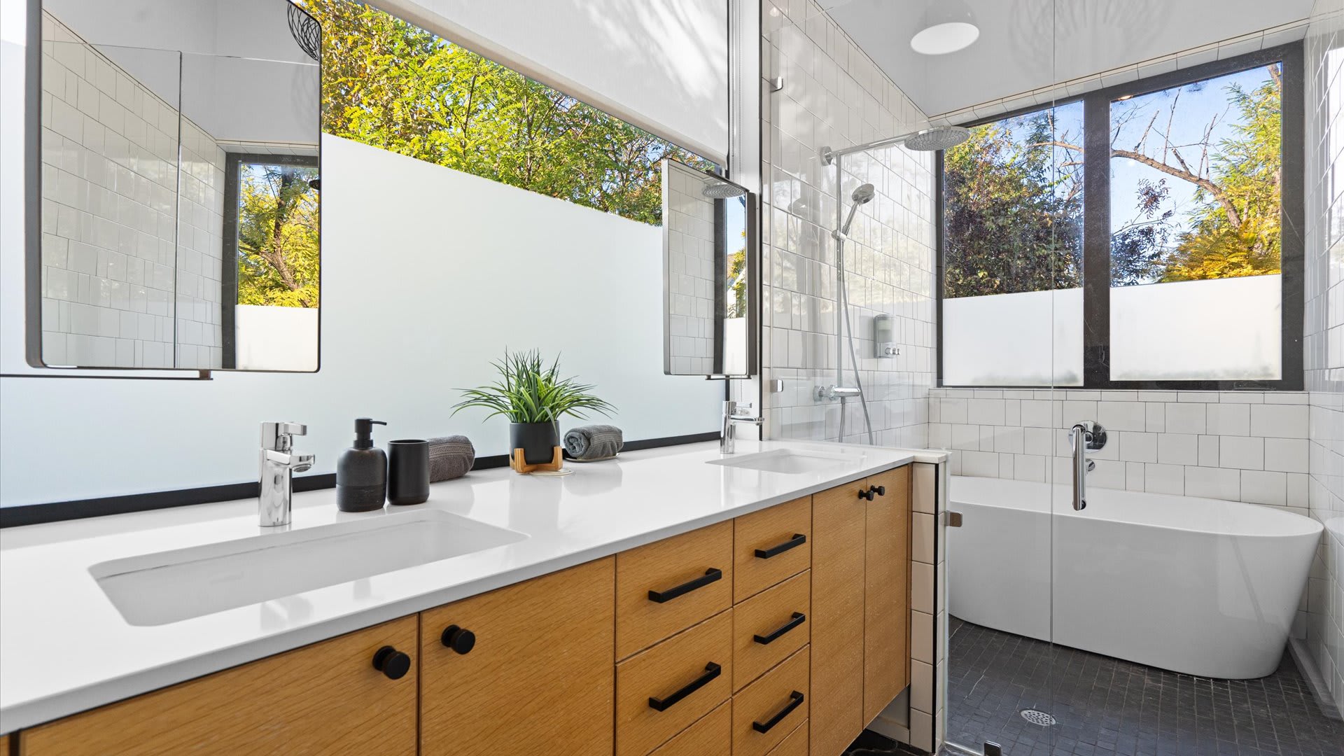 Spacious Bathroom With A Dual Basin and Relaxing Tub