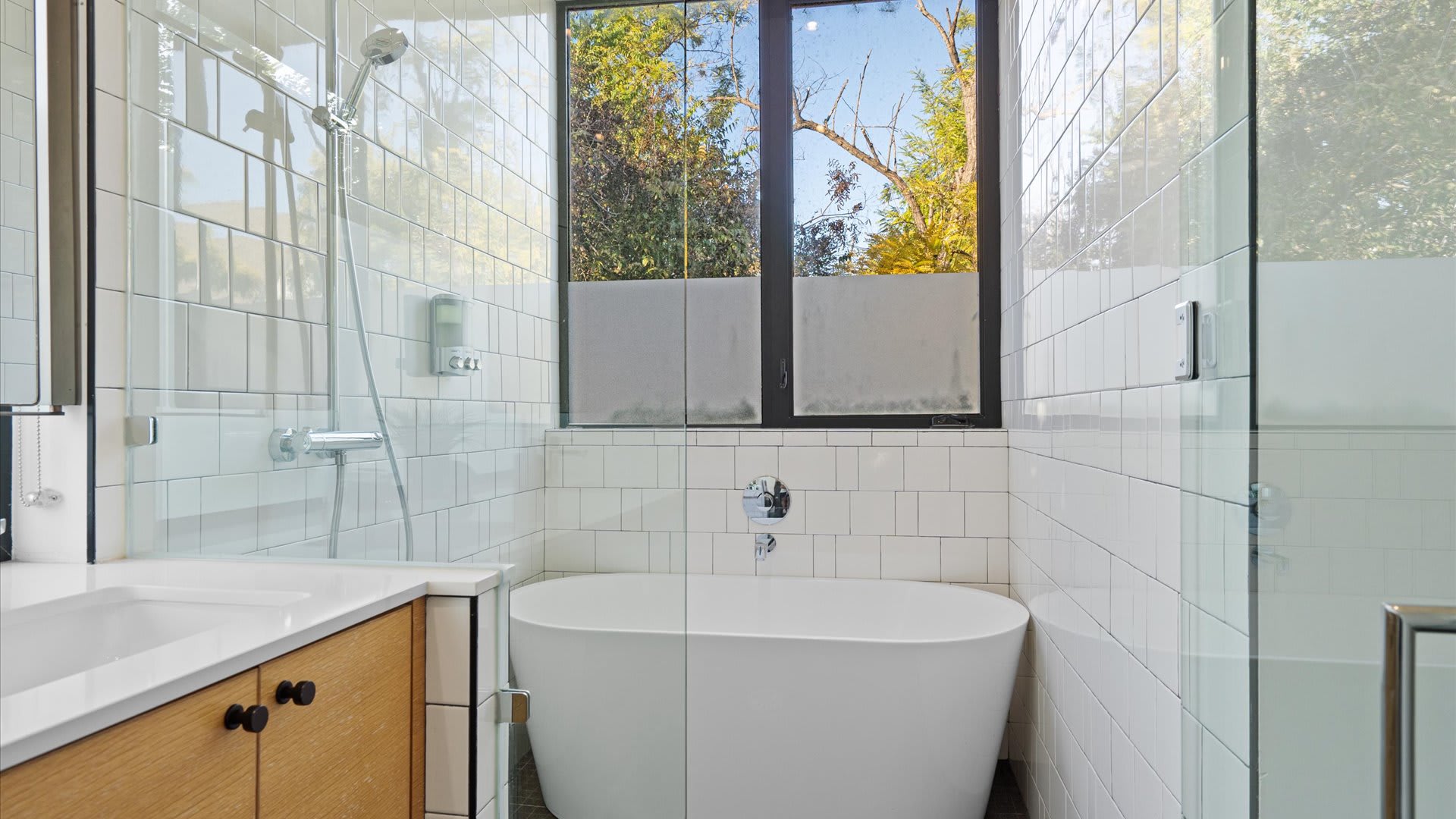 Spacious Bathroom With A Dual Basin and Relaxing Tub