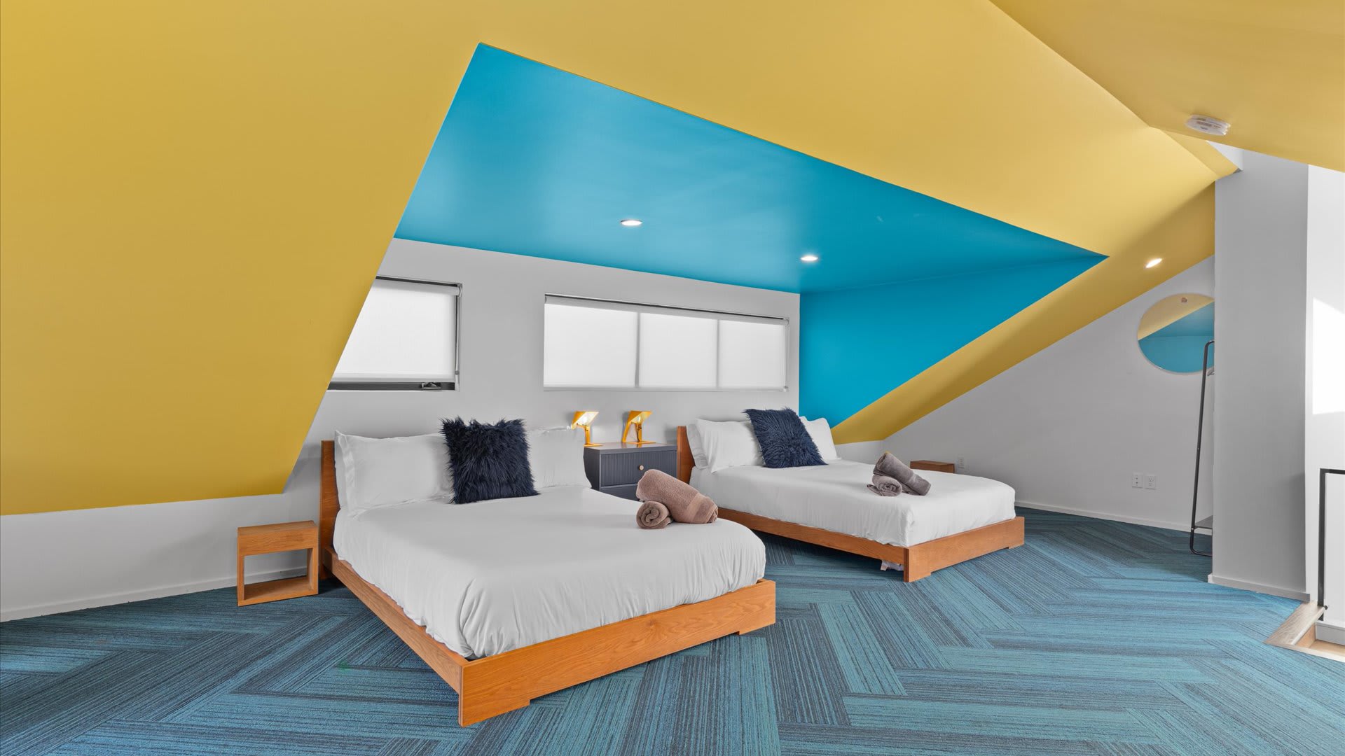 Vibrant Room With Two Queen Beds And Modern Decor