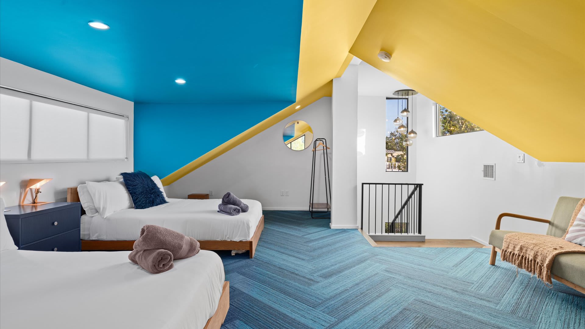 Vibrant Room With Two Queen Beds And Modern Decor