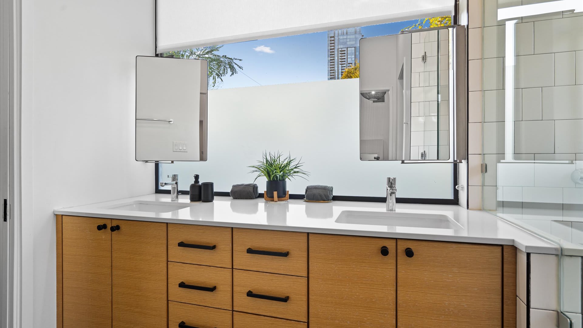 Spacious Bathroom With A Dual Basin and Relaxing Tub