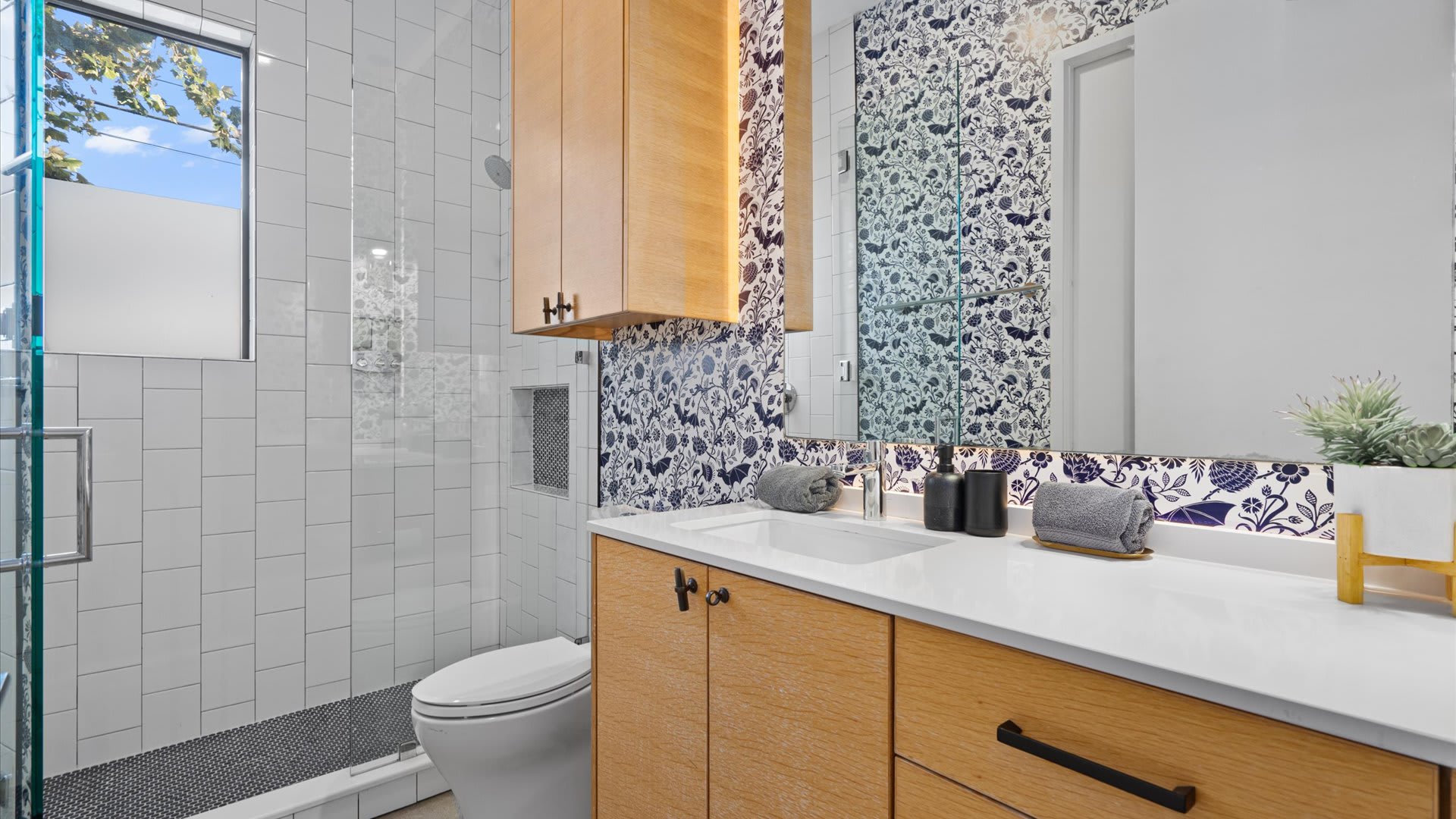 Bright And Contemporary Bathroom Featuring A Walk-In Shower