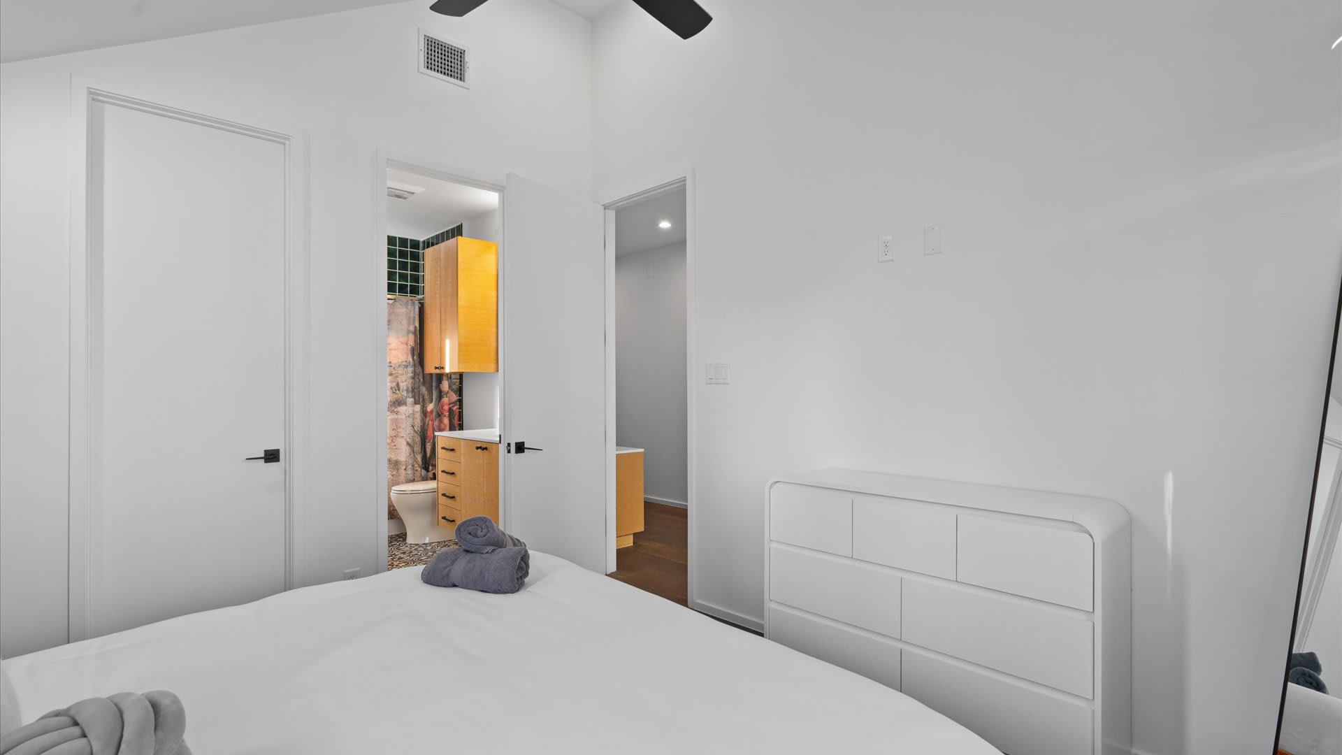 Vibrant Bedroom With A King Bed And Modern Lighting