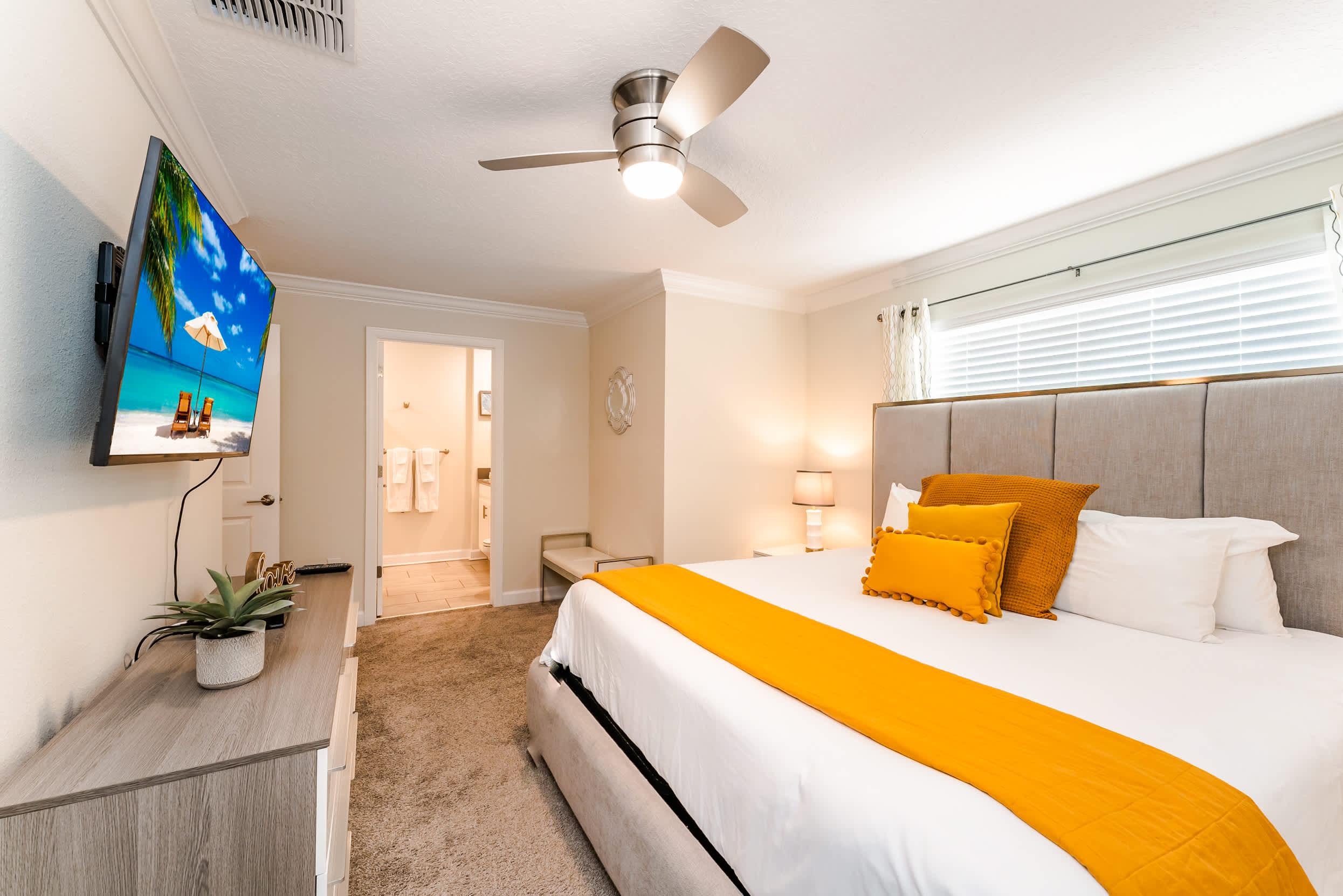 Relax in this cozy bedroom with a plush bed and modern amenities, perfect for unwinding after a day of adventure.