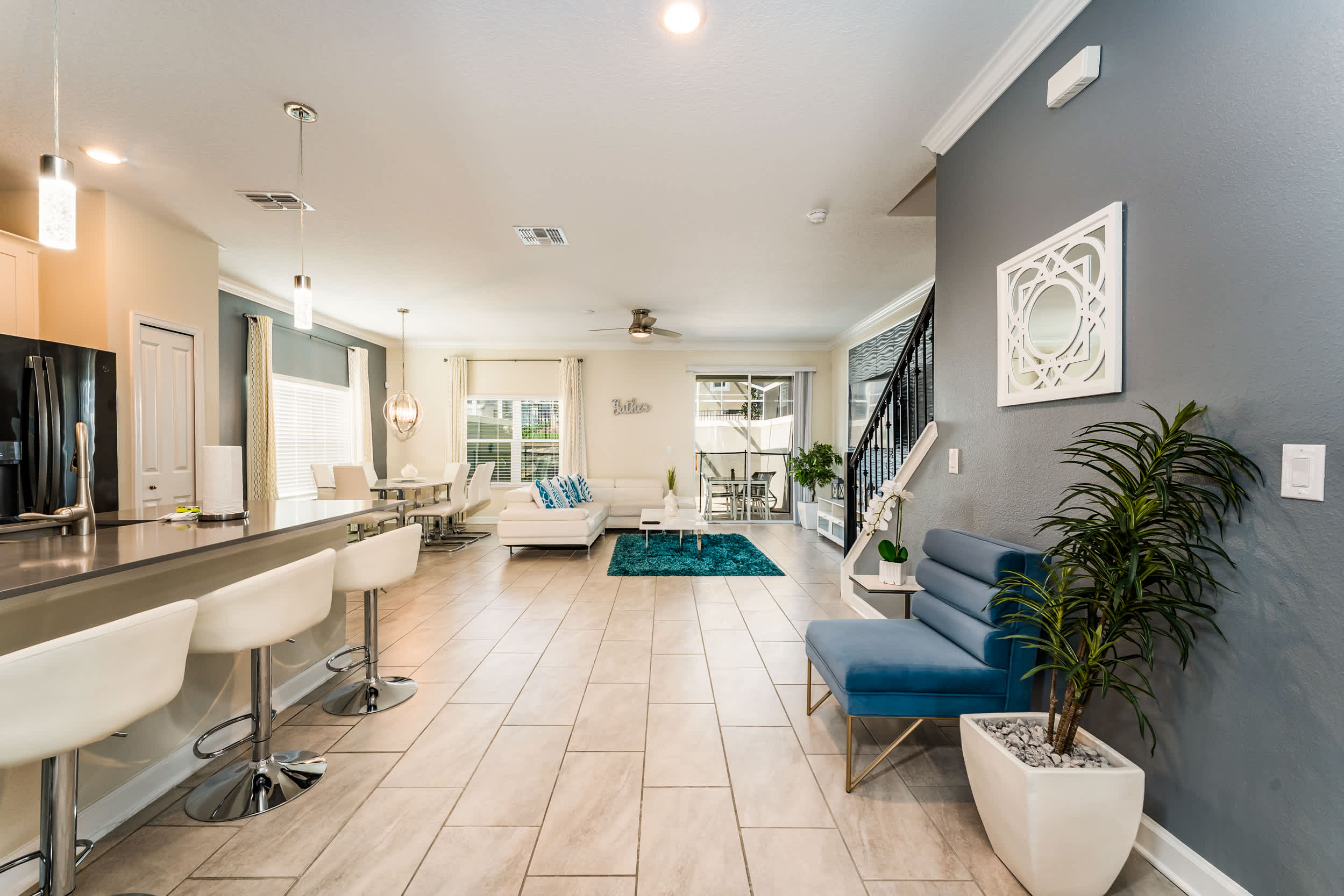 Experience luxury in this spacious open-plan living area with modern decor, perfect for relaxation and entertaining.