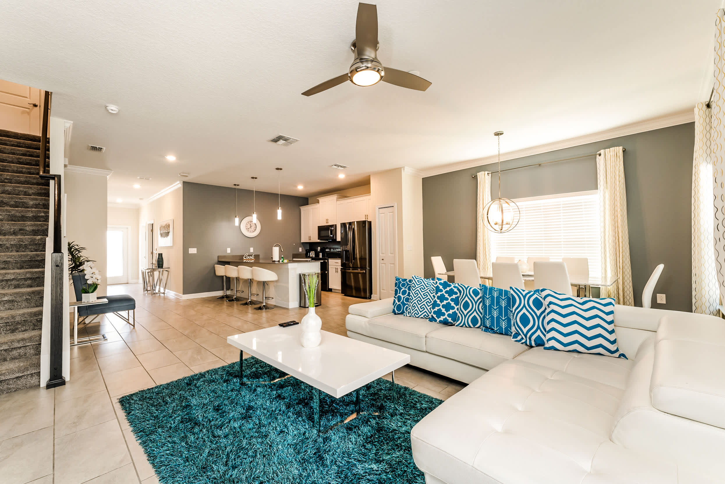 Experience luxury in this open-plan living space with modern kitchen, chic dining area, and cozy lounge perfect for gatherings.