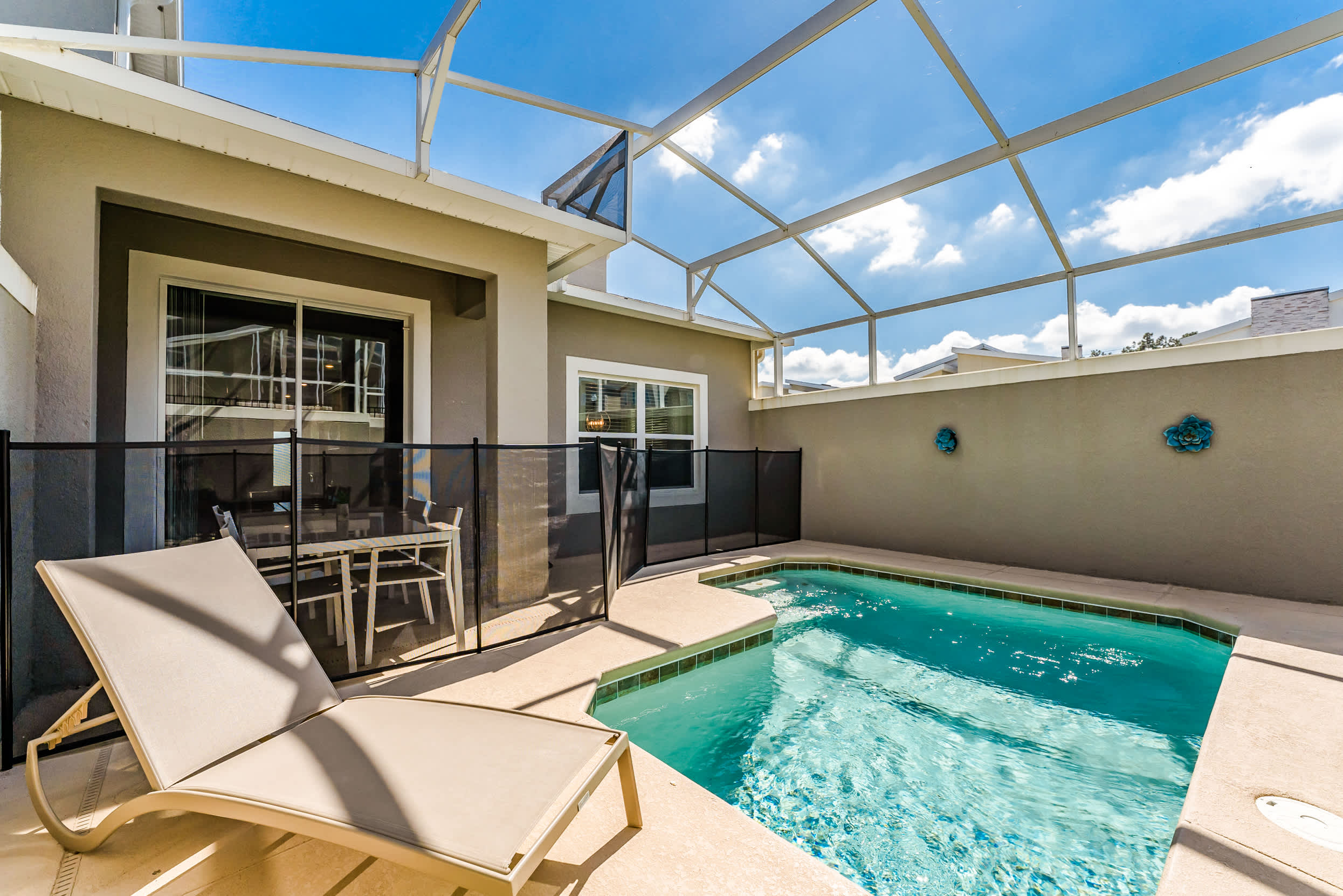 Enjoy a relaxing day by your private pool, complete with a lounge chair and dining area under the sun.