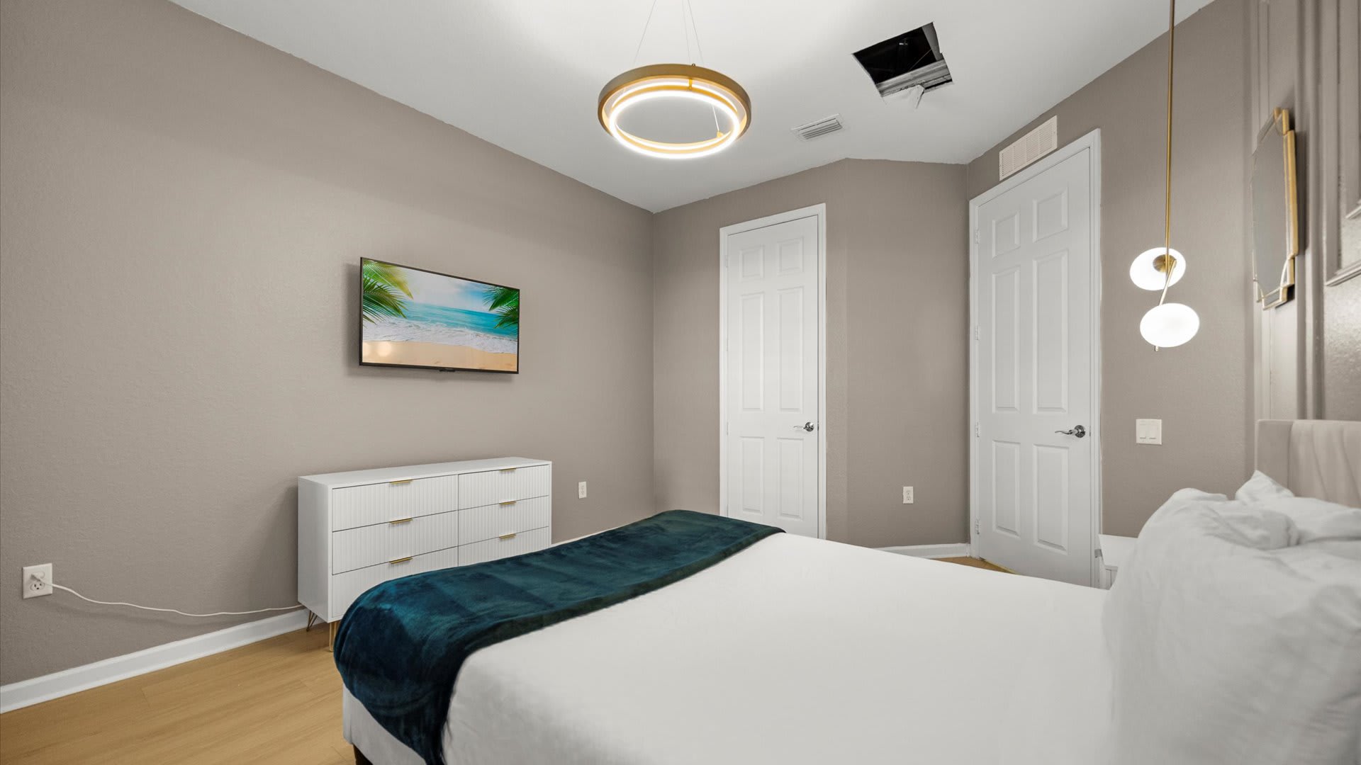 Elegant Queen Bedroom – Soft lighting and calming décor make this room a peaceful place to unwind.