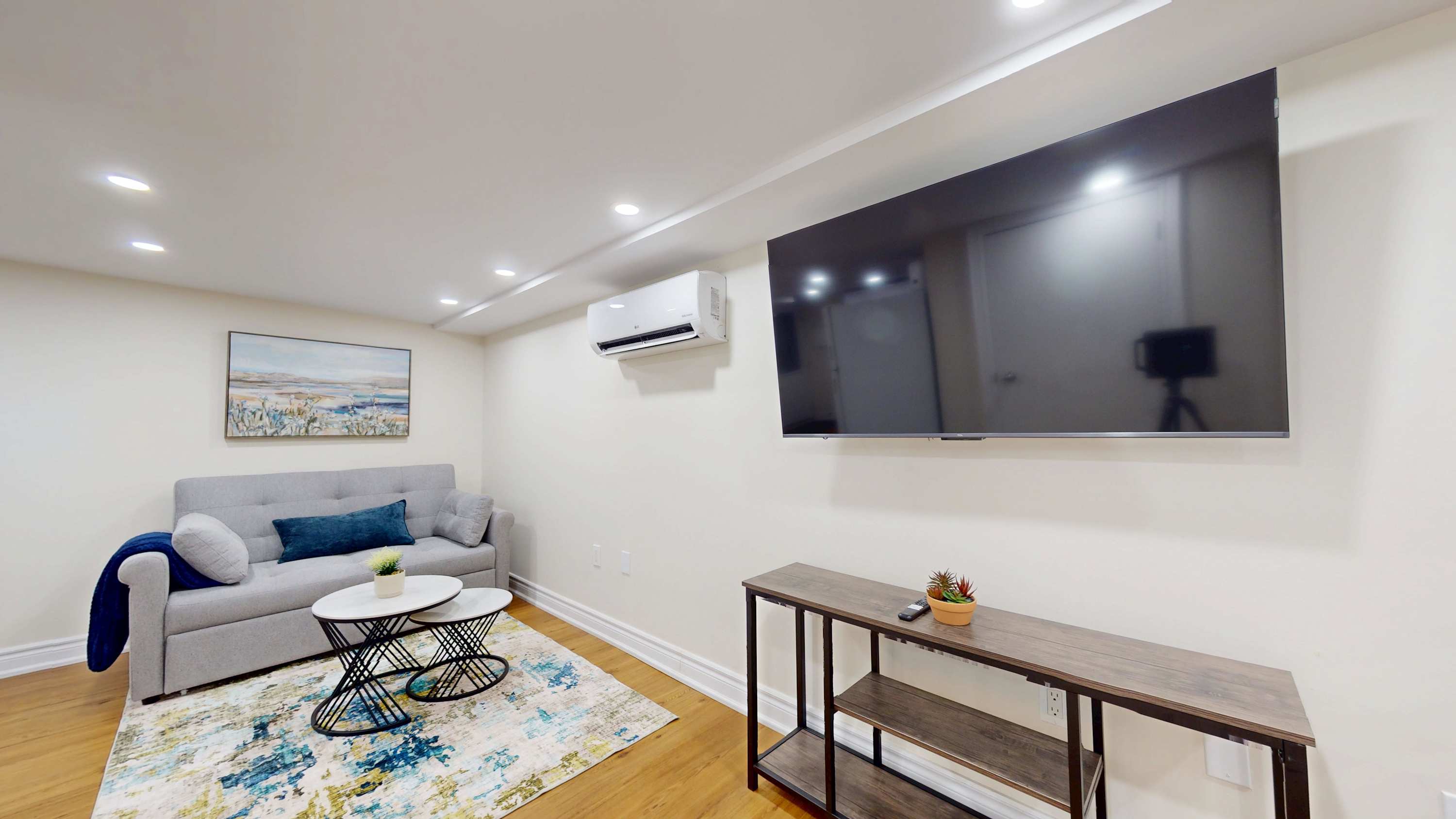 Living Area with Large Wall-Mounted TV
