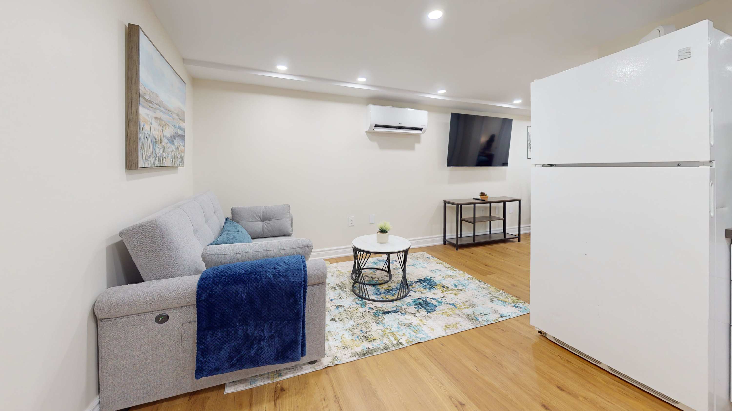 Living Area with Large Wall-Mounted TV
