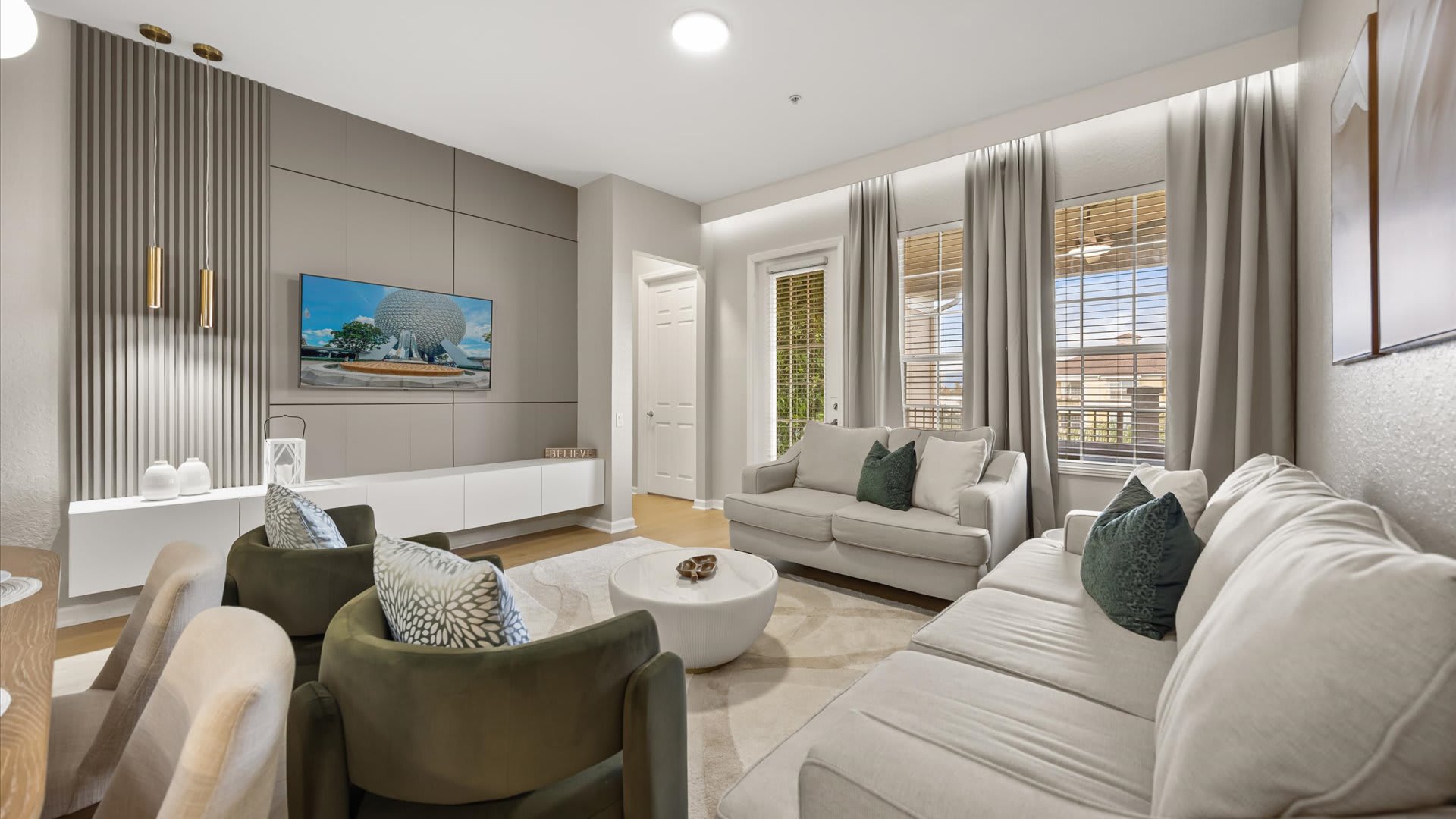 Contemporary living room with sectional seating and natural light