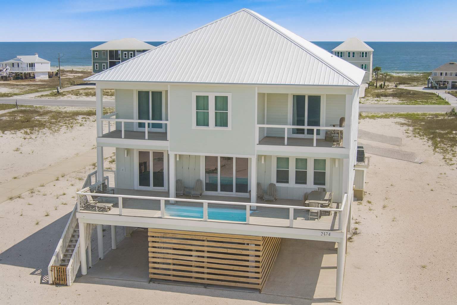 Designer coastal beach home w/ pool & elevator — Gulf Shores, AL — vacation rental