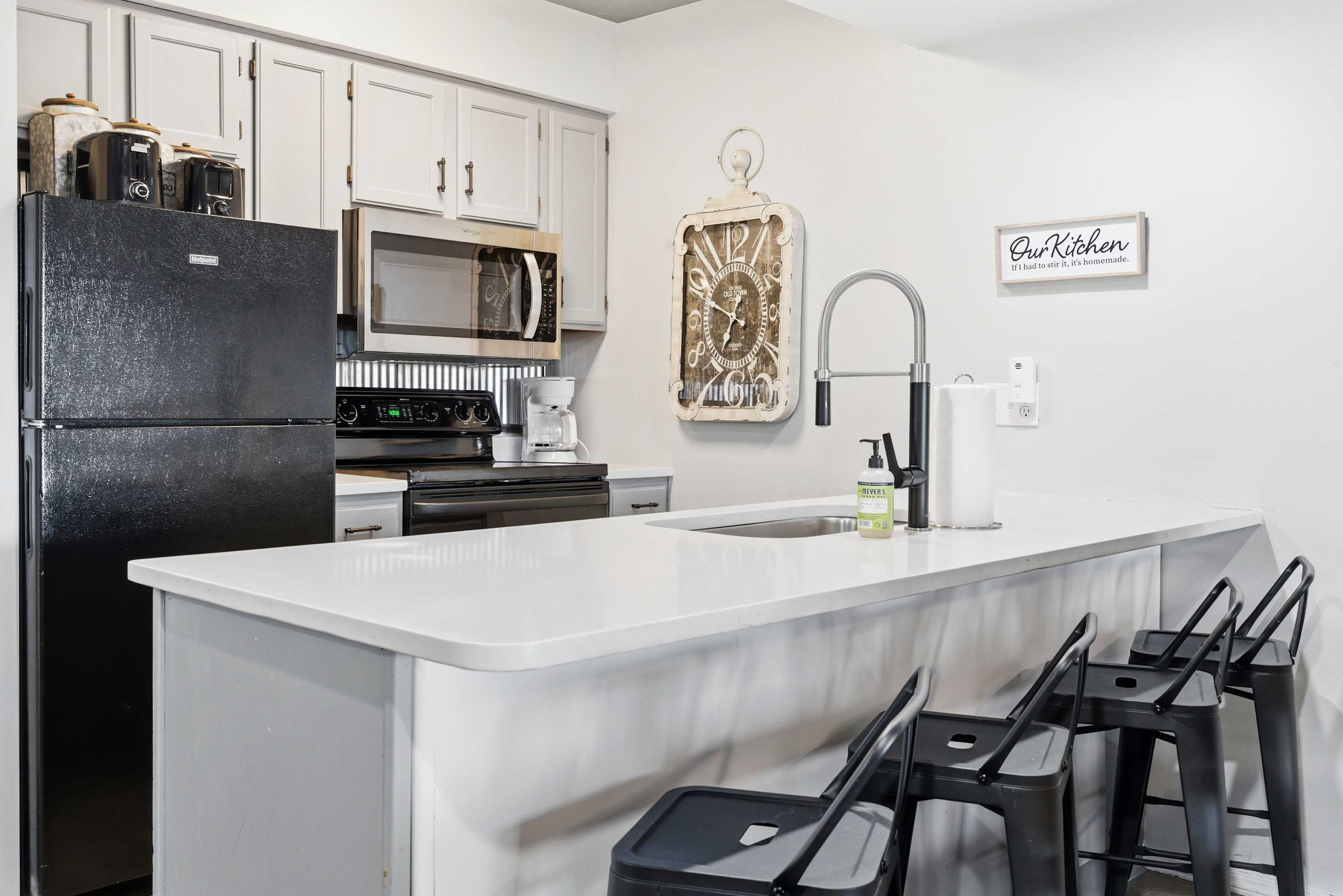 The open kitchen offers ample space & all the comforts of home​