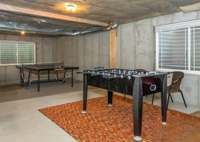 Game room with Foosball, ping pong, and a lounge area