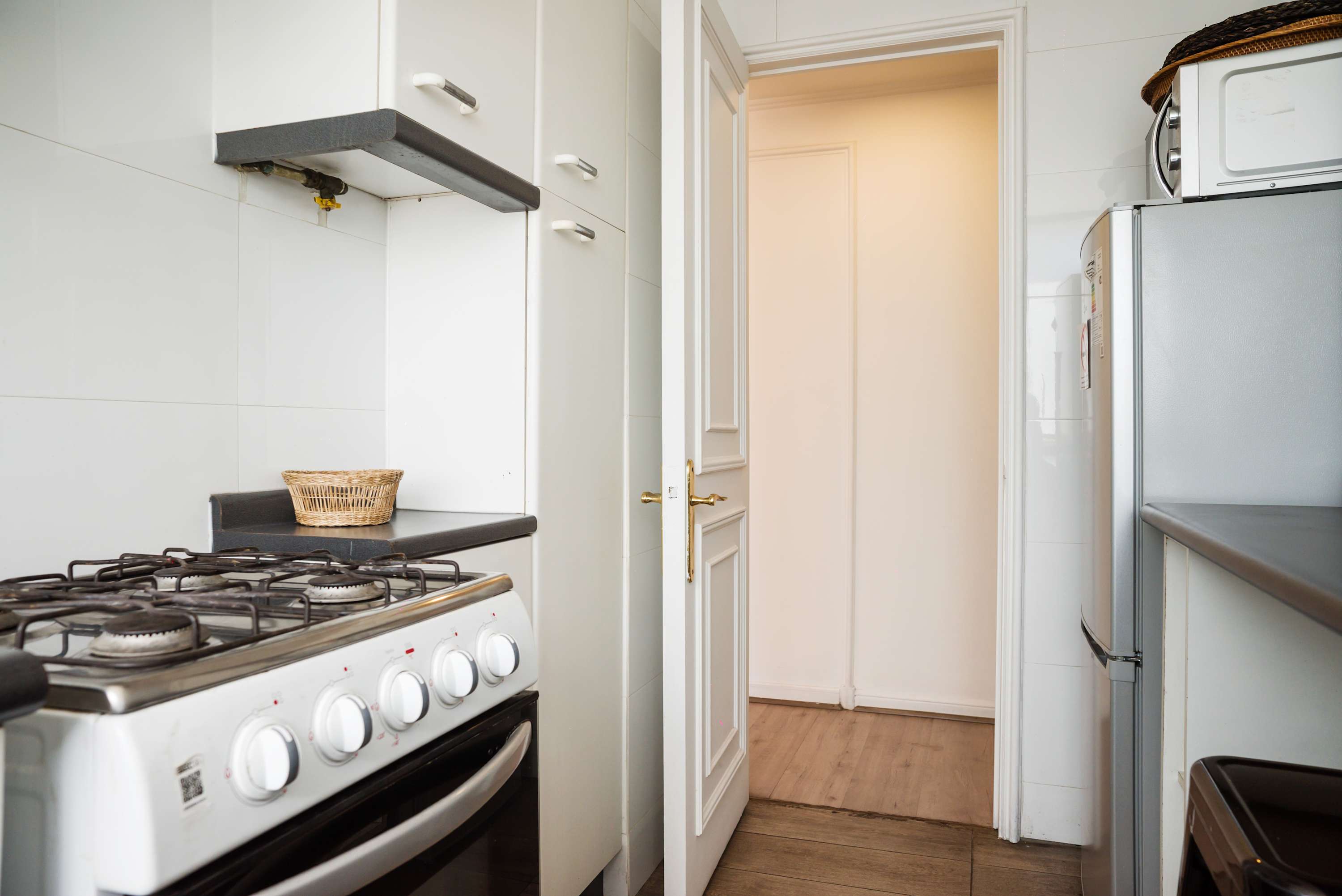 Cozy kitchen with modern appliances, perfect for preparing meals during your stay.
