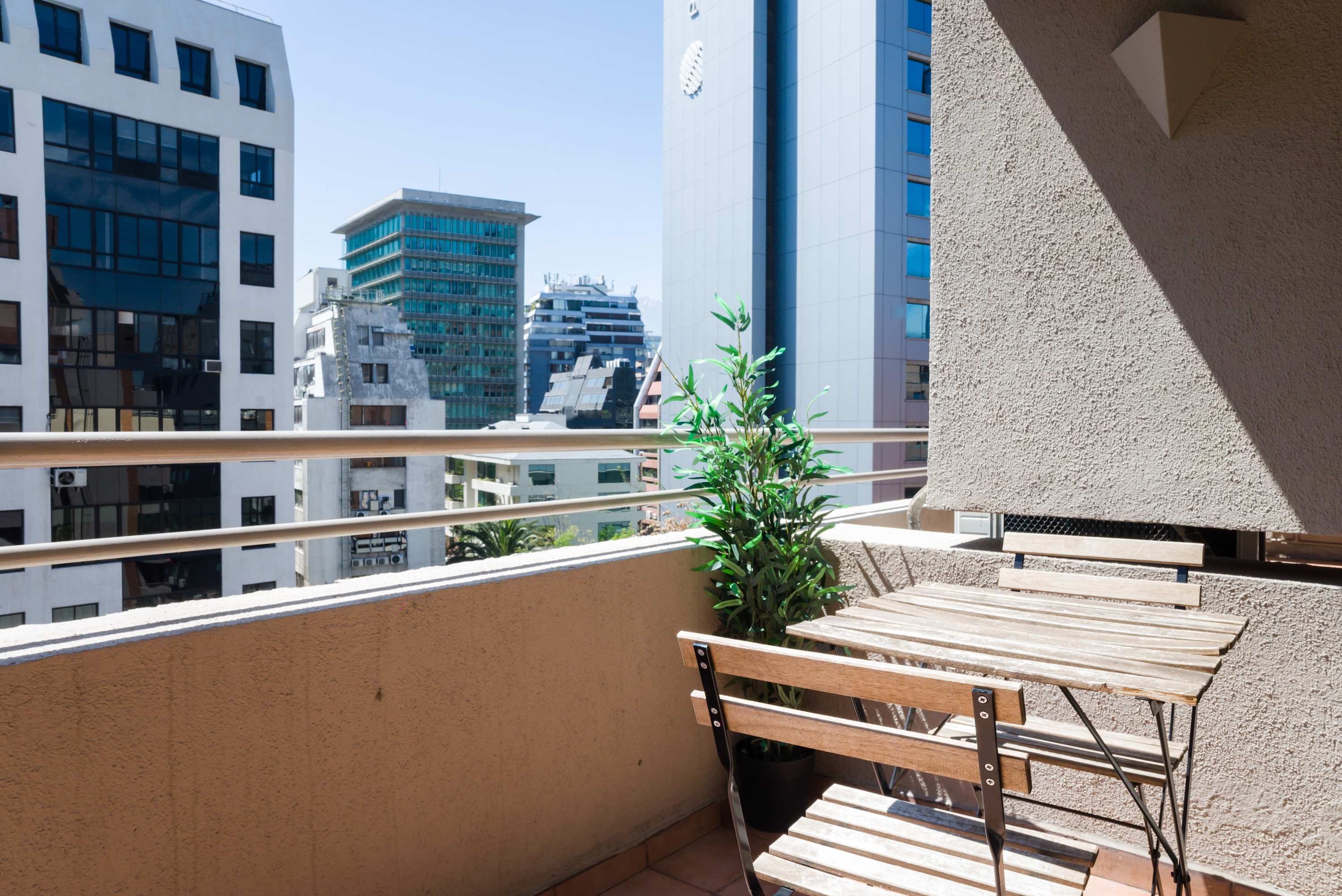 Enjoy a sunny retreat on your private balcony with city views, perfect for morning coffee or evening relaxation.