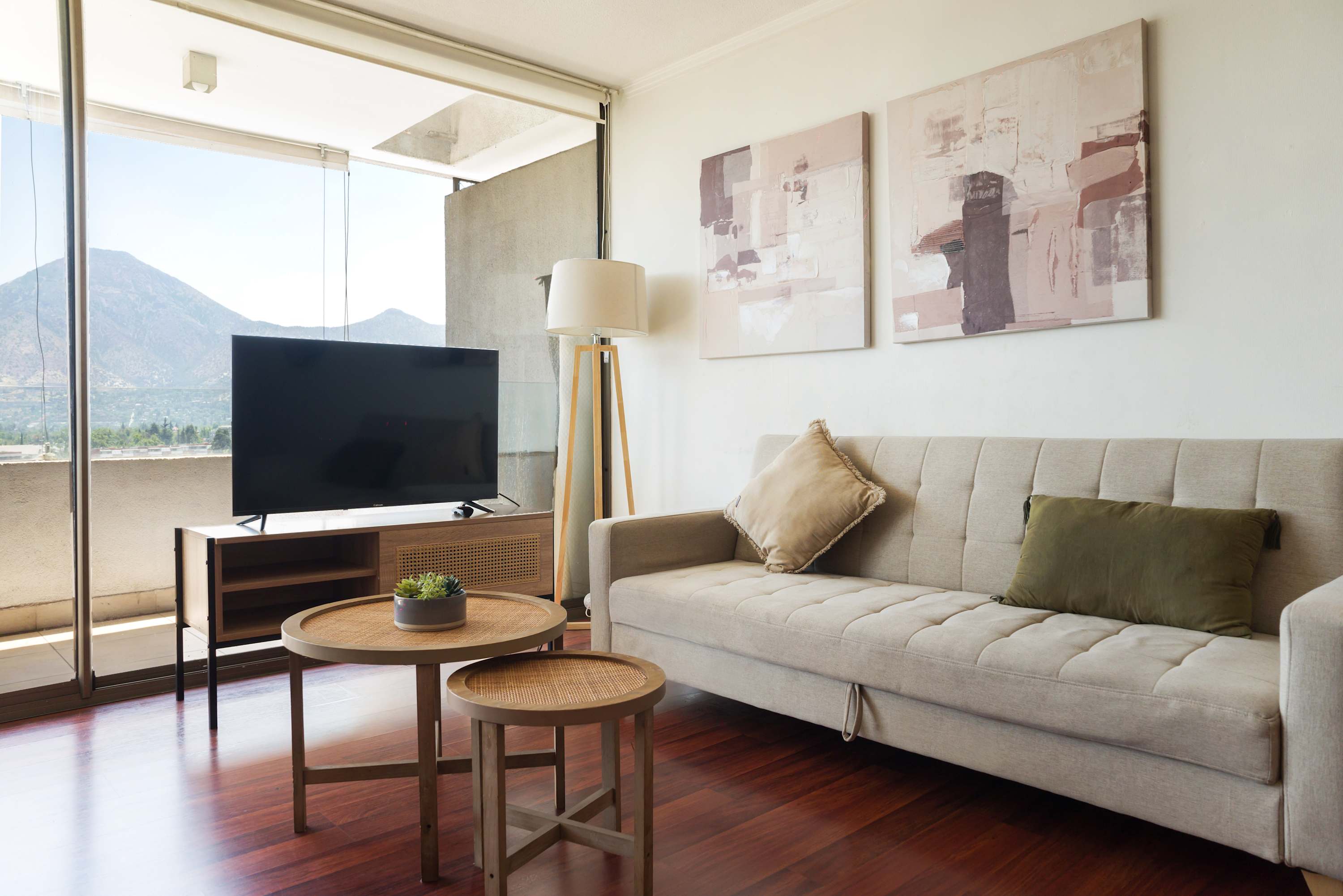 Relax in a cozy living room with stunning mountain views and modern decor, perfect for unwinding after a day of exploring.