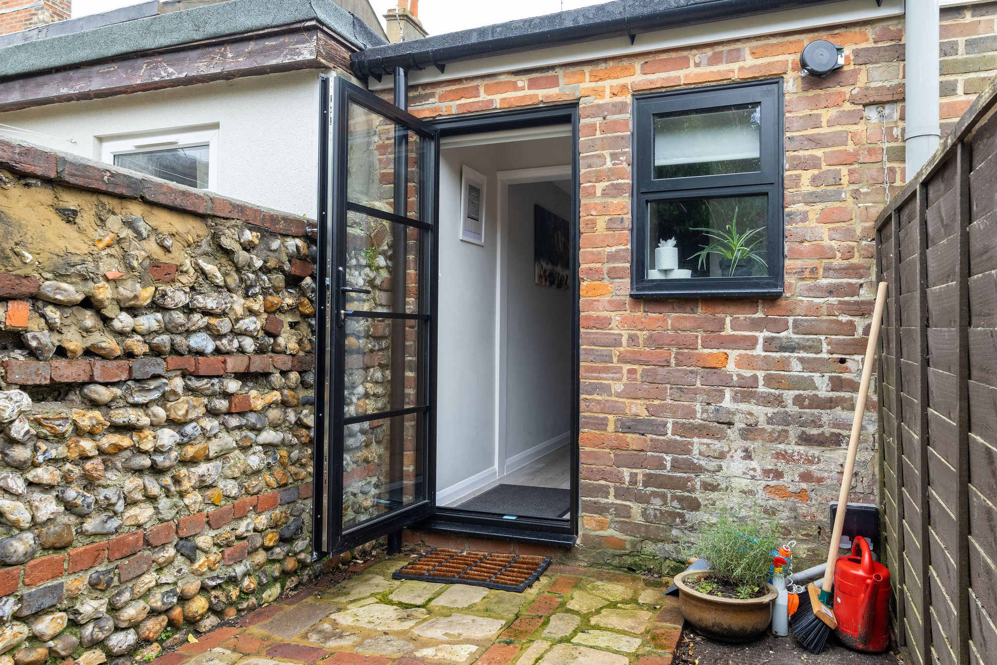 Step out to the enclosed courtyard at the rear of the property!