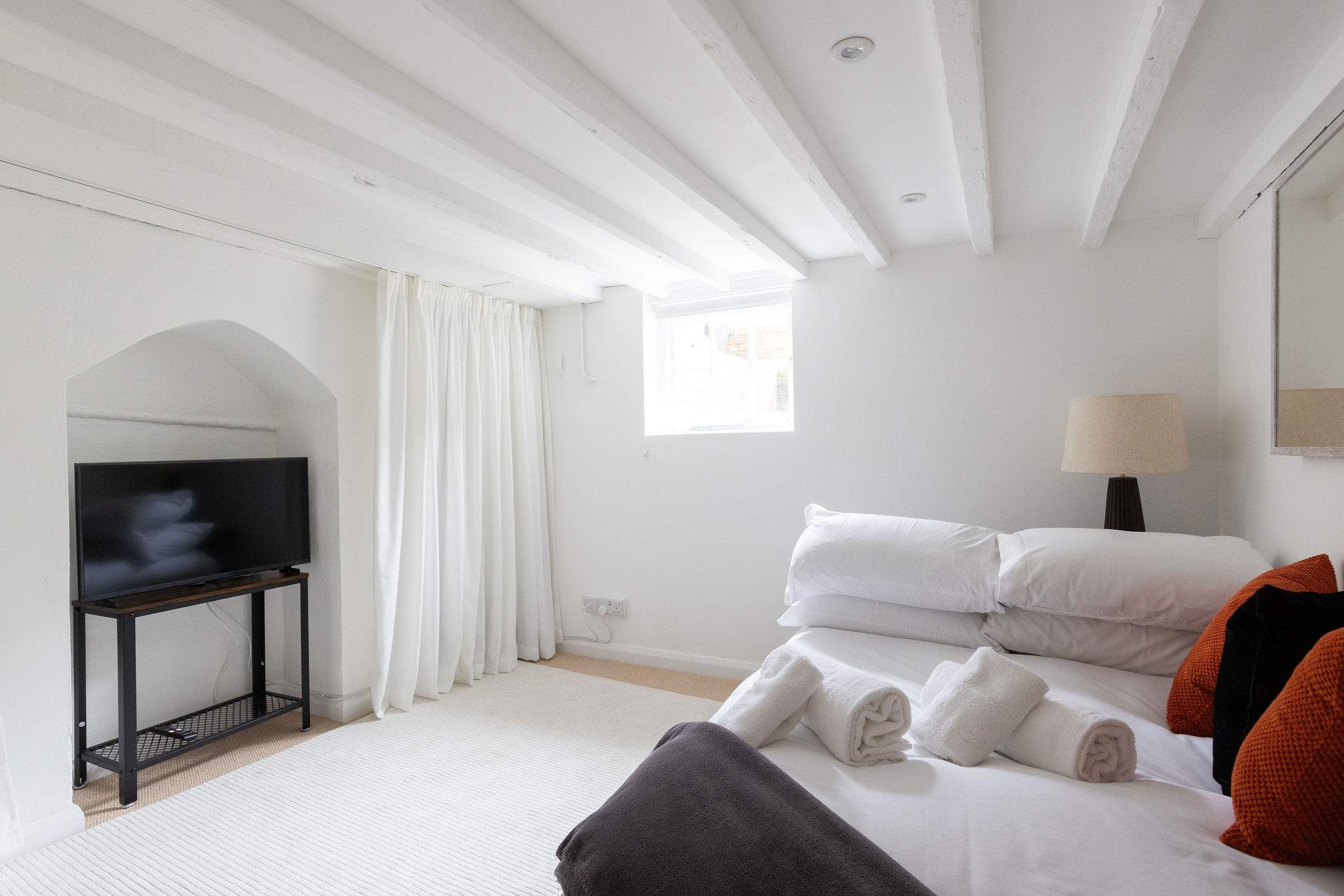 Head downstairs to the basement snug – a flexible second lounge or third sleeping space.