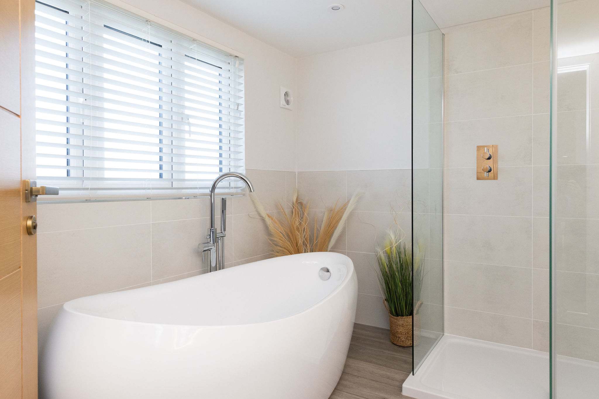 Stylish ensuite with freestanding bath and walk in shower