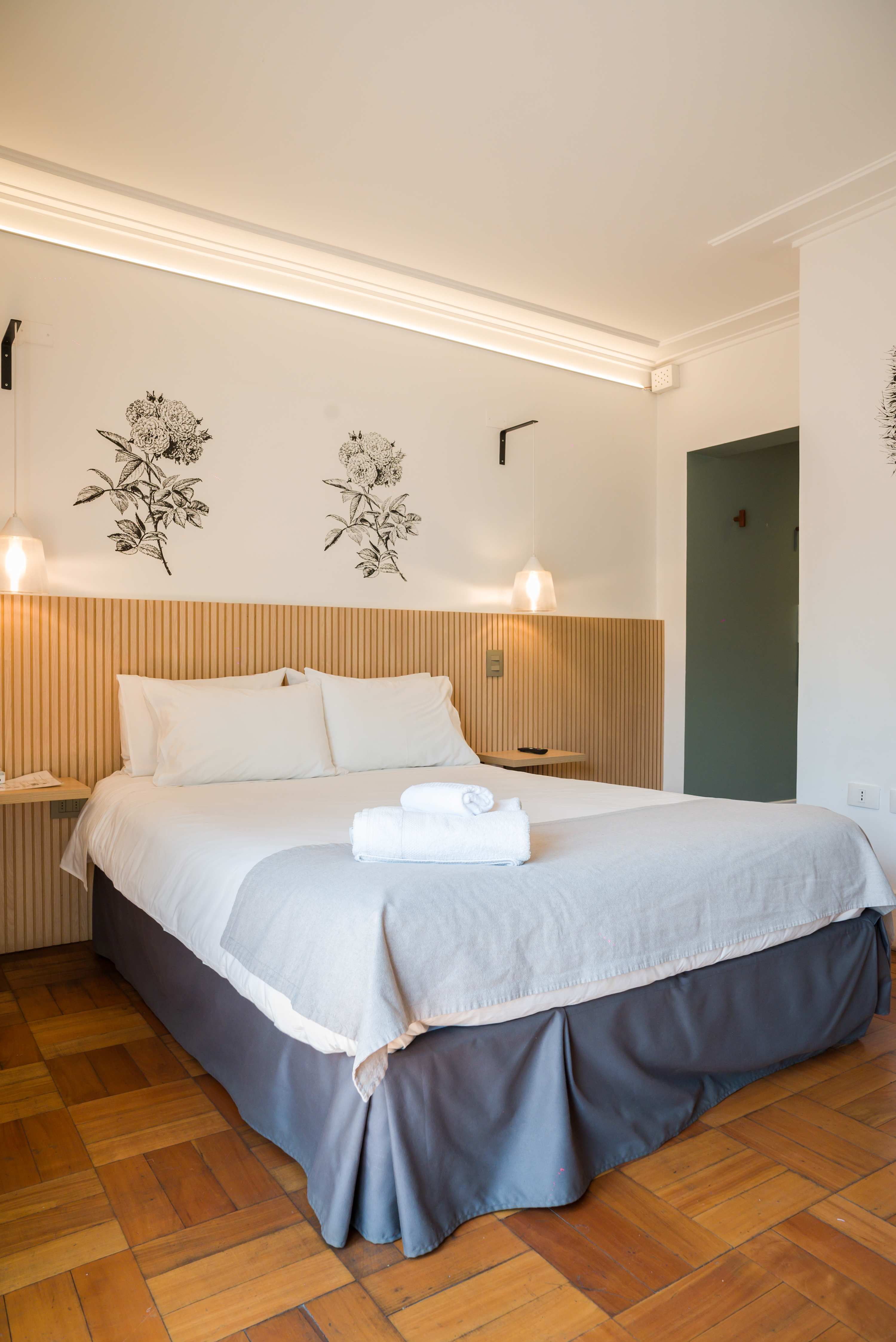 Cozy and stylish bedroom with elegant decor and soft lighting, perfect for a relaxing stay.