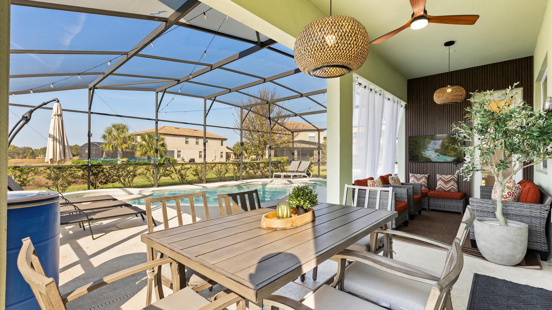 Outdoor dining and lounge area overlooking the pool.