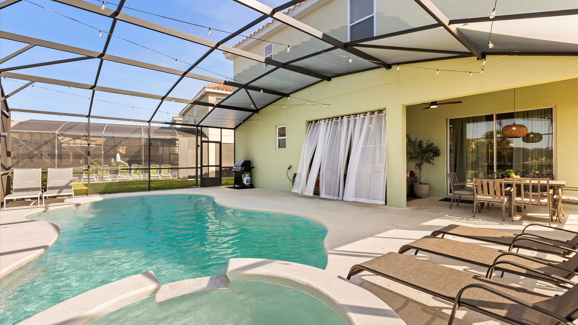 Spacious pool deck with loungers for relaxed afternoons.