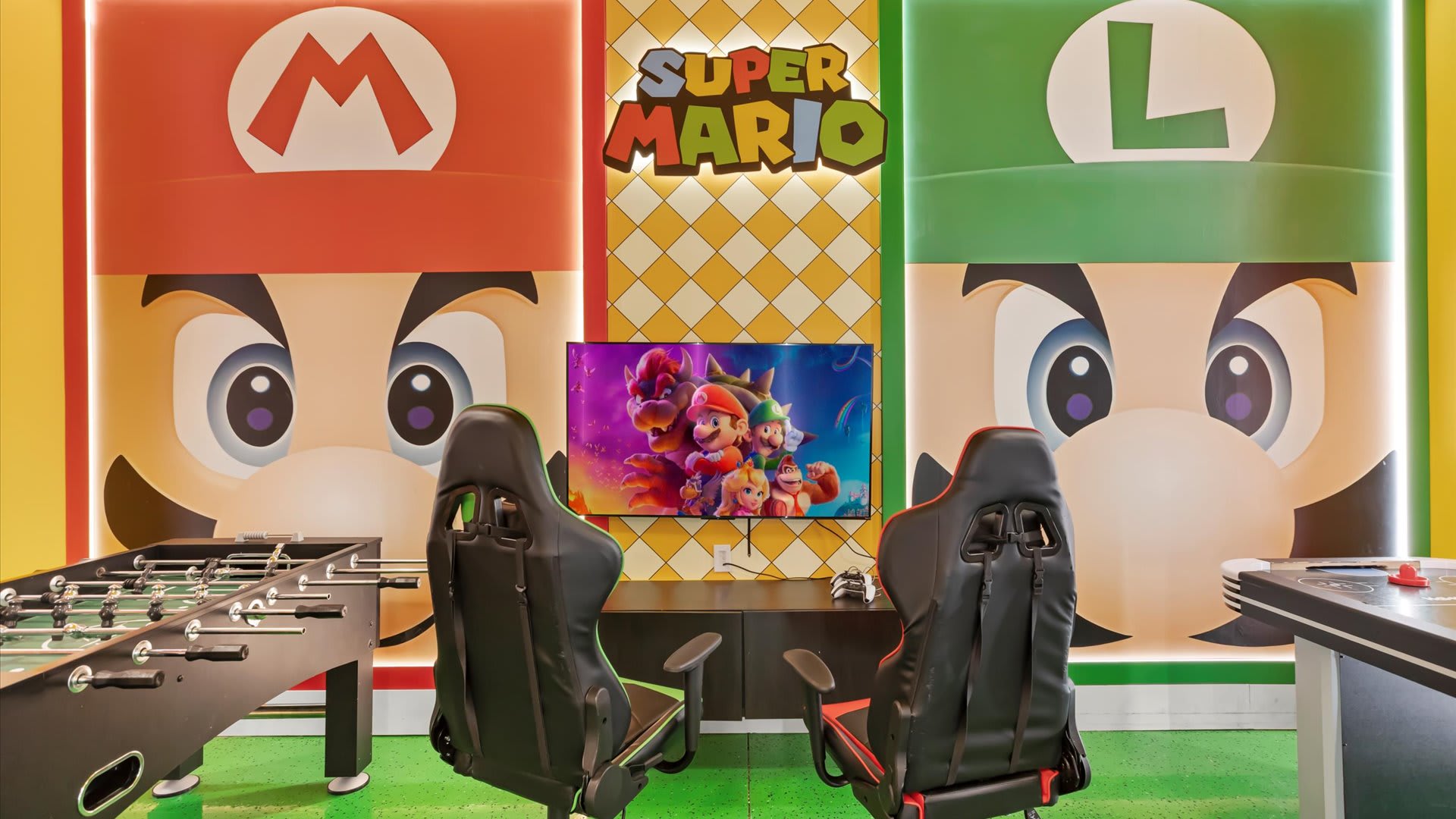Interactive kids’ gaming space with Mario-inspired artwork.