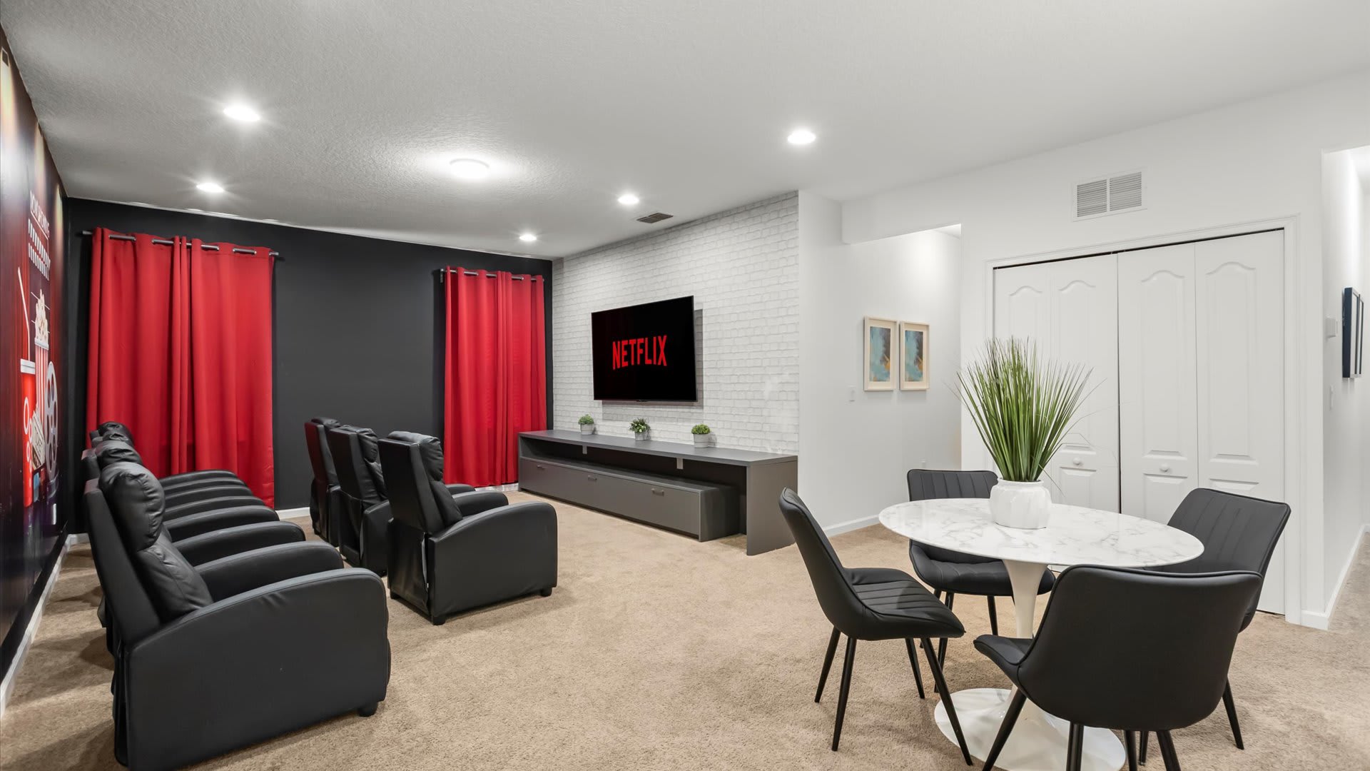 Private in-home cinema with plush recliners and a giant screen.