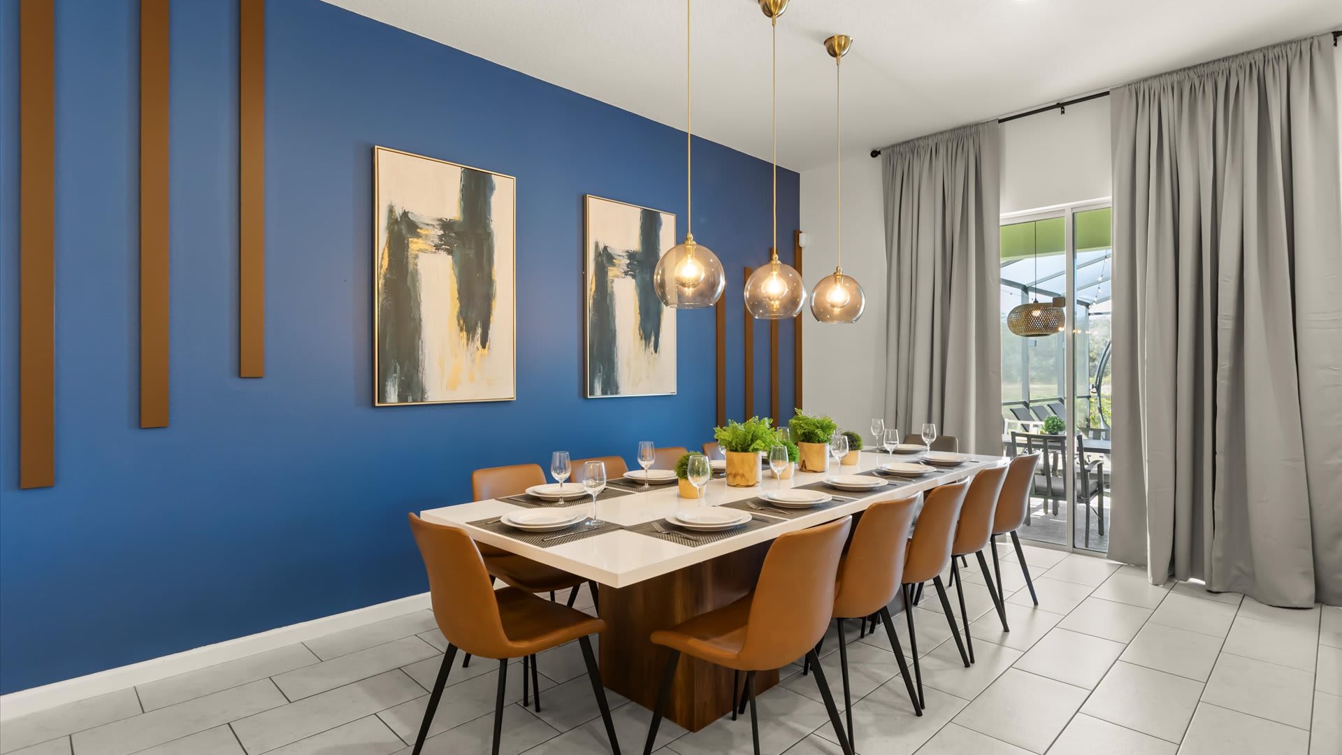Modern dining area with feature blue accent wall.
