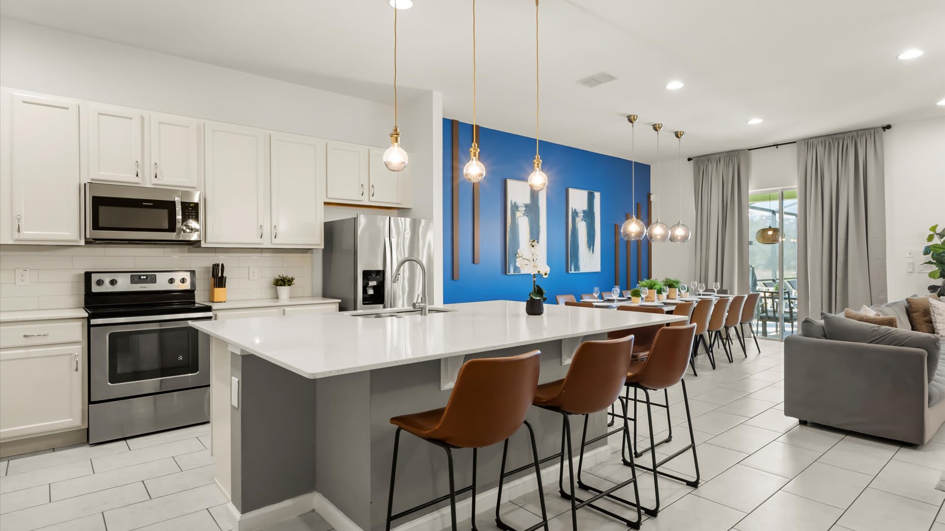 Fully stocked chef’s kitchen with a breakfast bar.