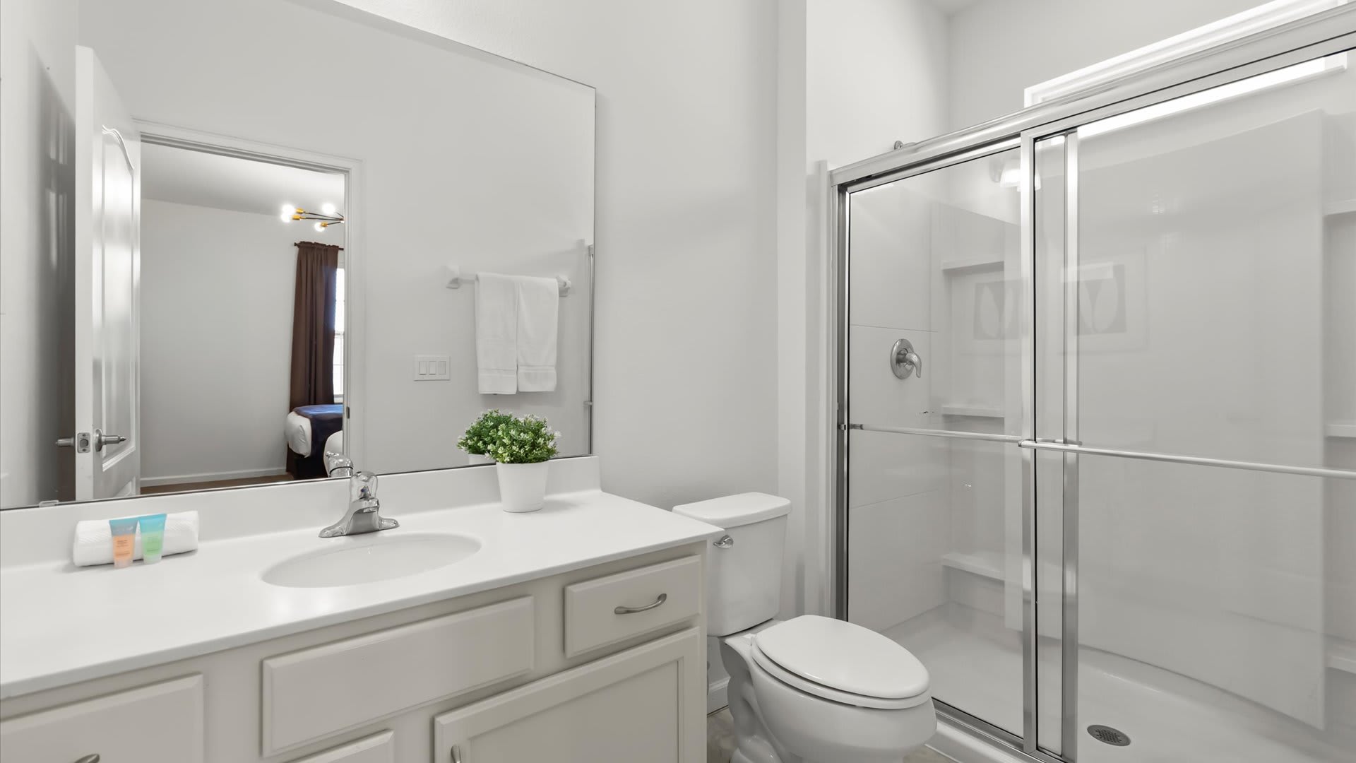 Ensuite bathroom with bright white vanity.