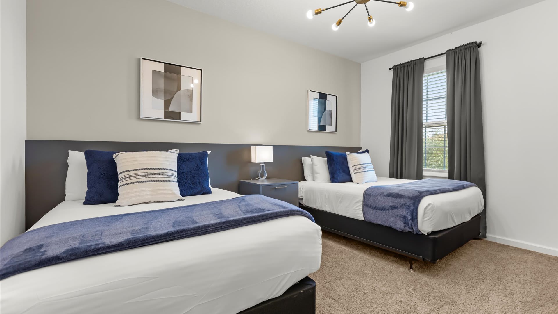 Calming twin bedroom with soft décor and natural light.