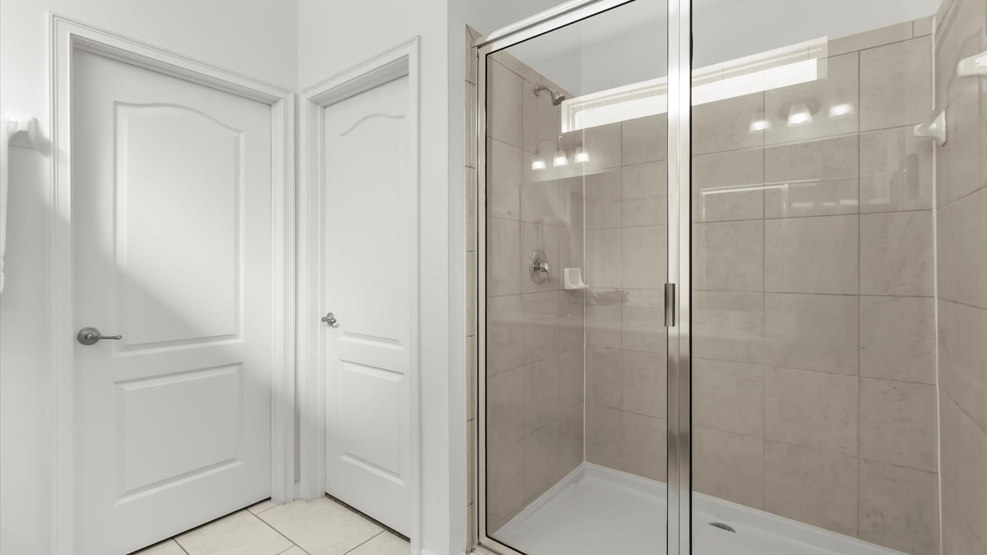 Bright bathroom with large walk-in shower.