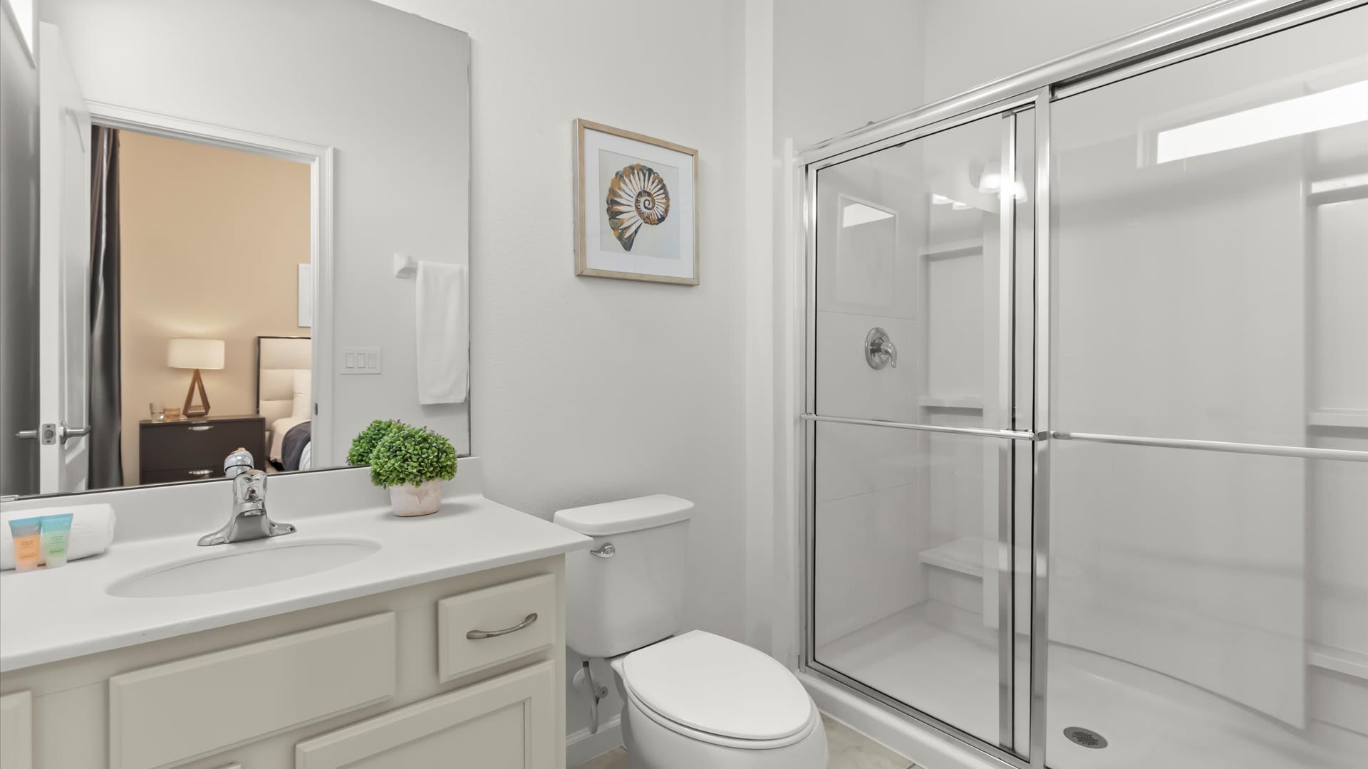 Ensuite bathroom with double sinks and a full shower.