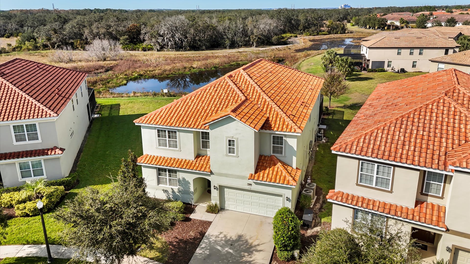 Aerial view of the home in a peaceful community setting.