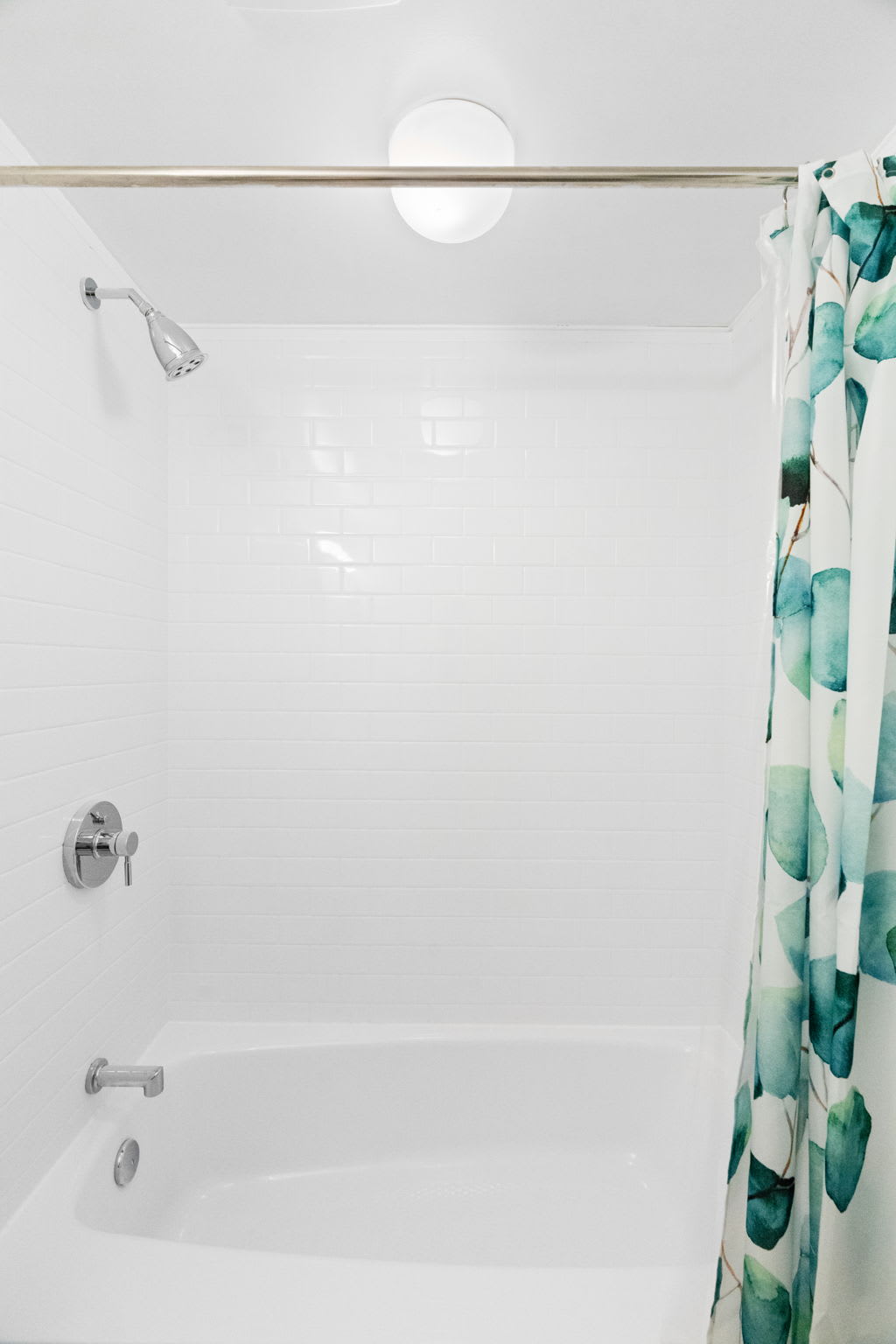 Bright bathroom with walk-in shower and fresh linens at Pocono cabin getaway