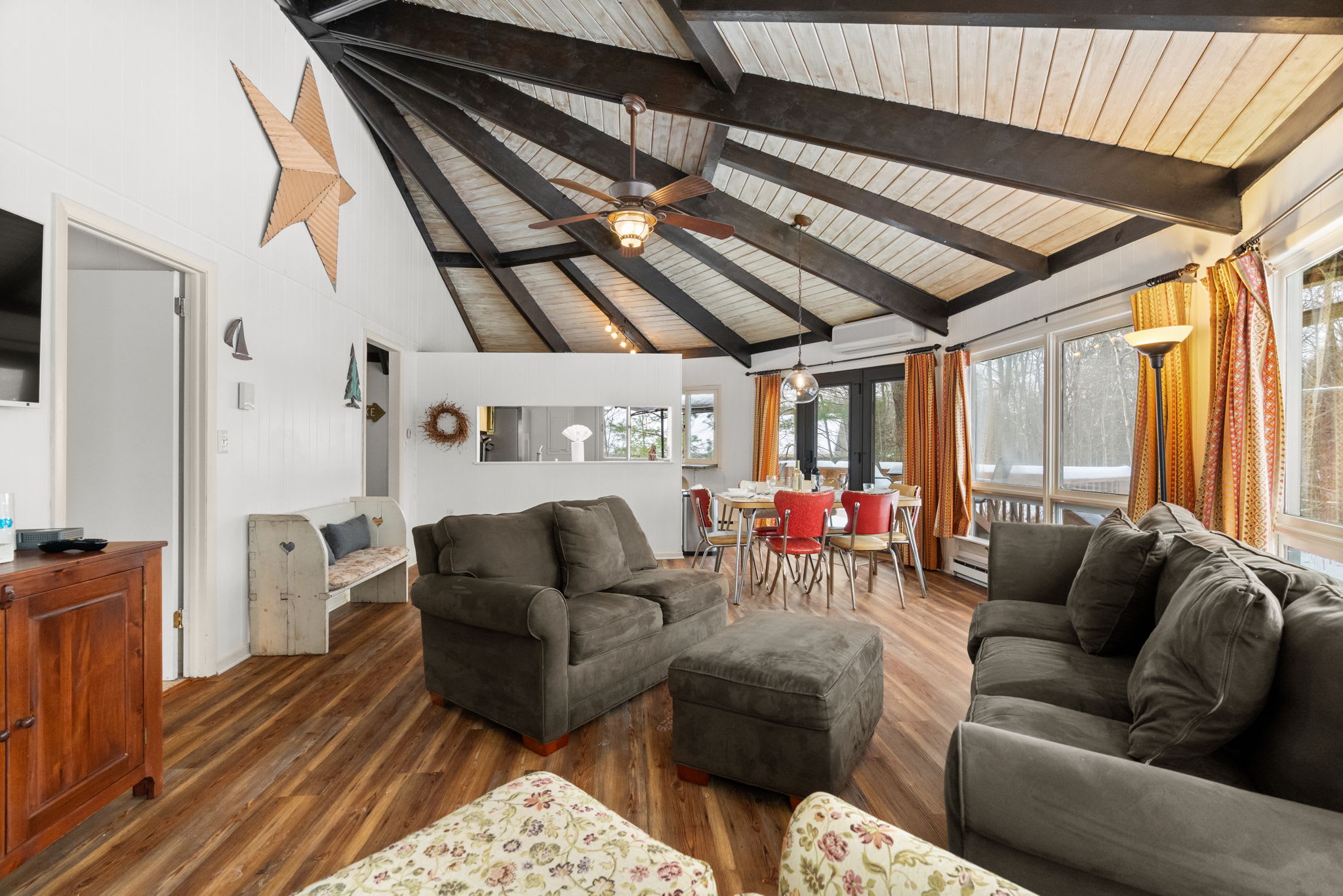 Cozy seating area with comfortable sofa under dramatic vaulted ceiling in Pocono retreat