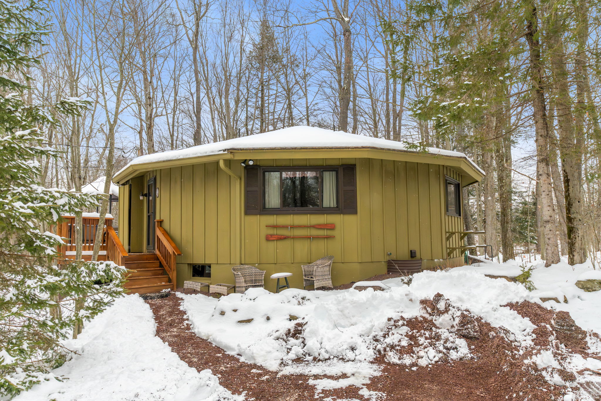 Picturesque winter view of cabin nestled in snowy Pocono Mountains woodland