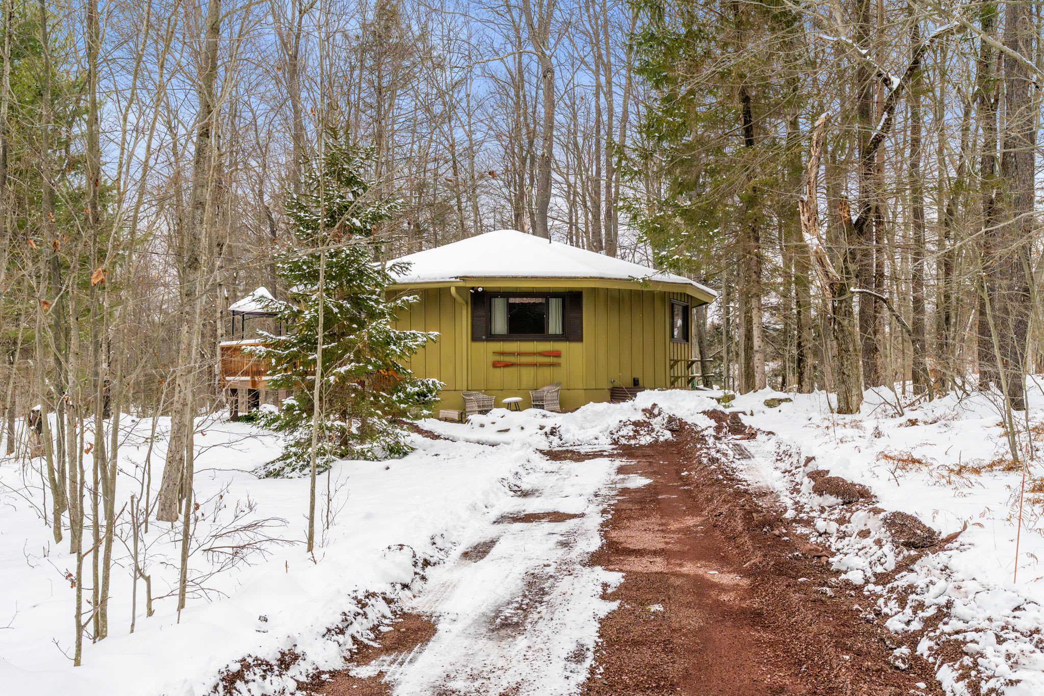 Scenic winter pathway leading to charming A-frame cabin at Lake Naomi Pocono retreat
