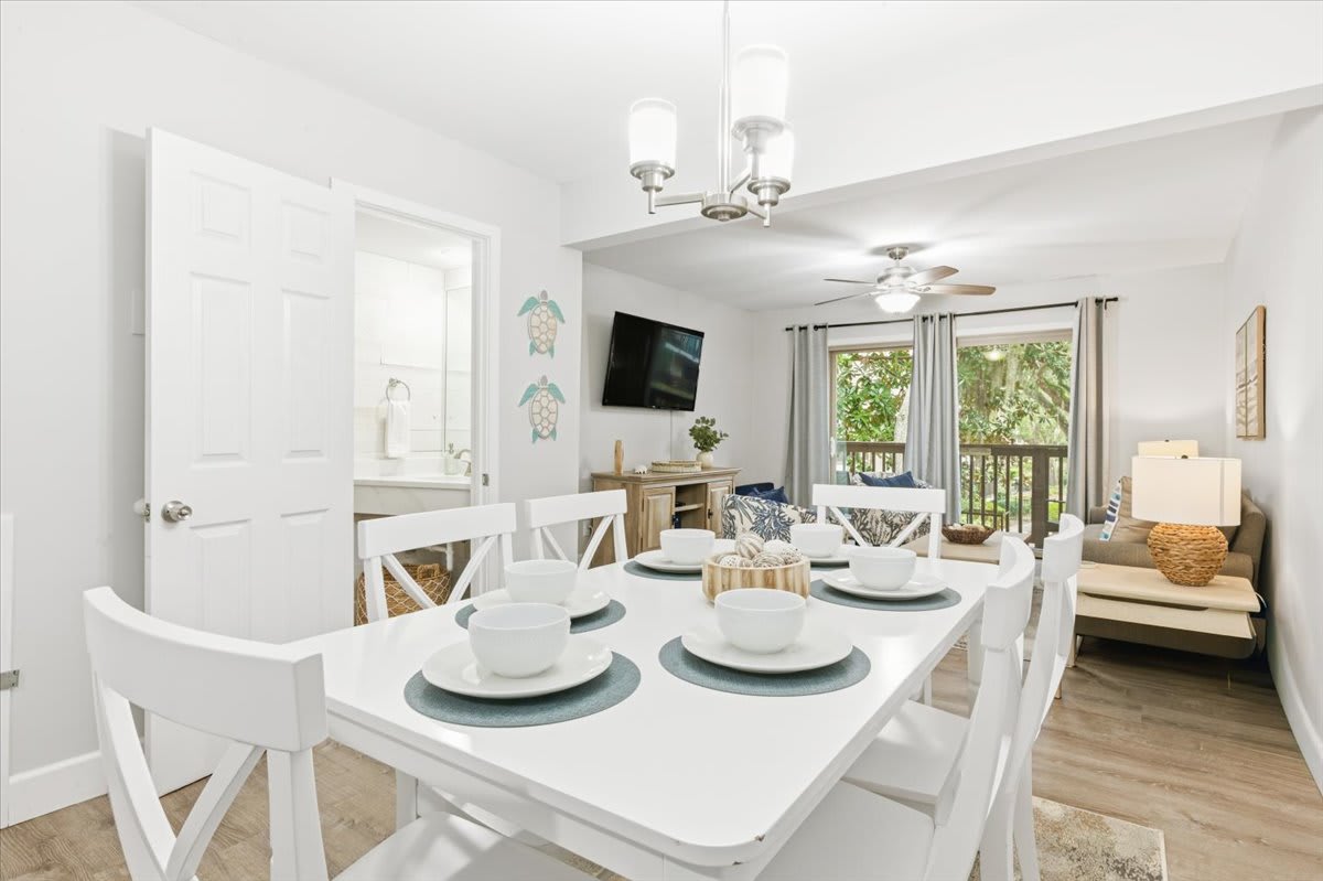 Bright dining for 6 by living room, coastal decor, perfect for family meals.