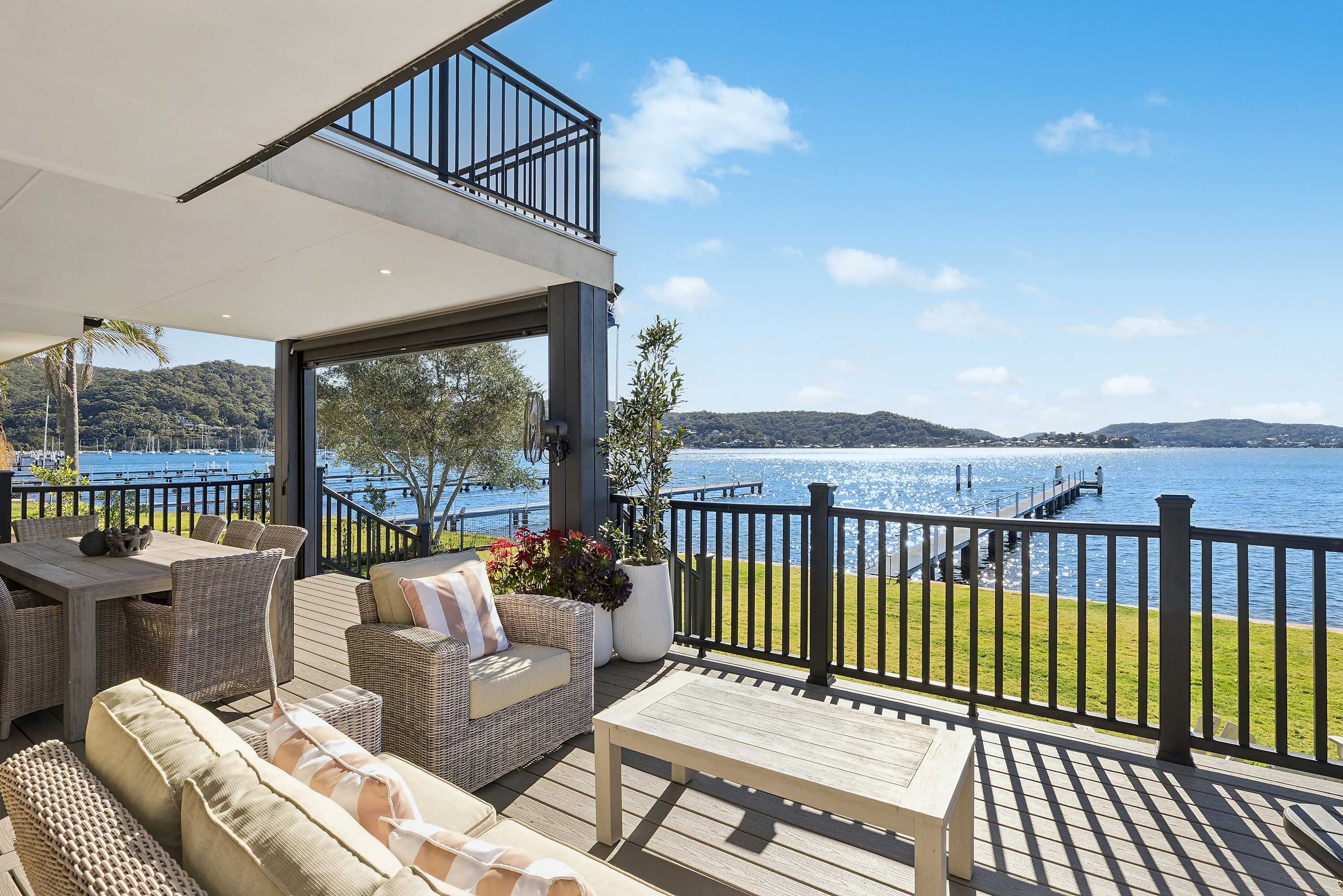 A private jetty on Brisbane Waters. Panoramic views from every room. Wake up and the bay is right there. Welcome to Waters Edge. This north-facing deep-waterfront estate offers a private jetty with boat mooring and panoramic views from Gosford Waterfront to Woy Woy. Enjoy an upper-level theatre room, a grand entertainer's kitchen, and two oversized waterfront decks. For families and groups wanting to be directly on the water, this is the most complete waterfront estate on the Central Coast.