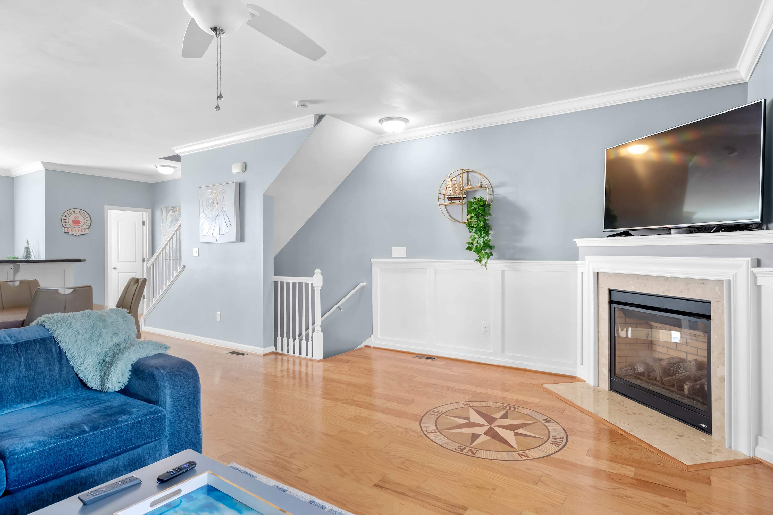 Living area with sectional sofa, TV, and gas fireplace