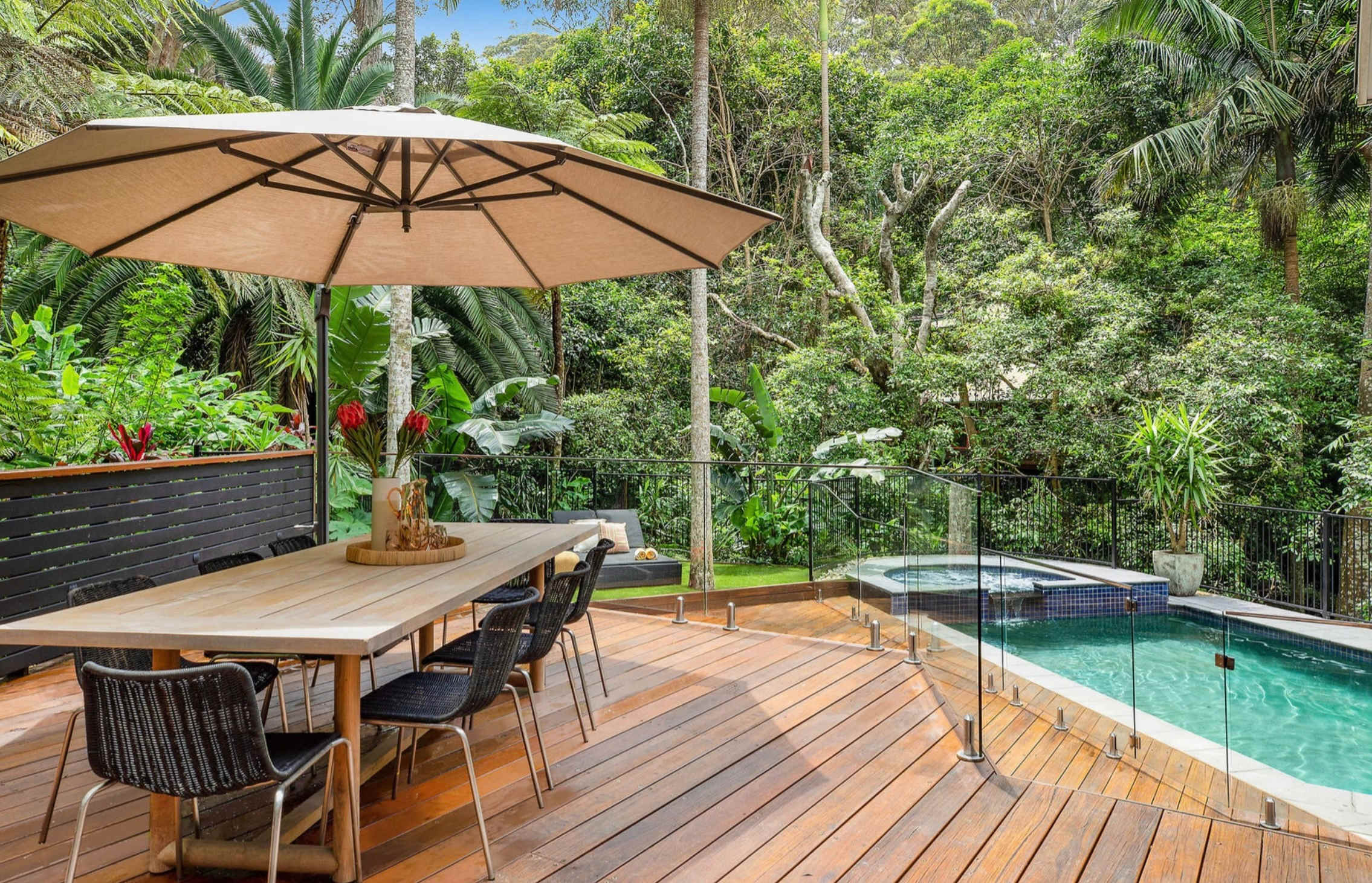 A pool and spa in tropical gardens. An 85