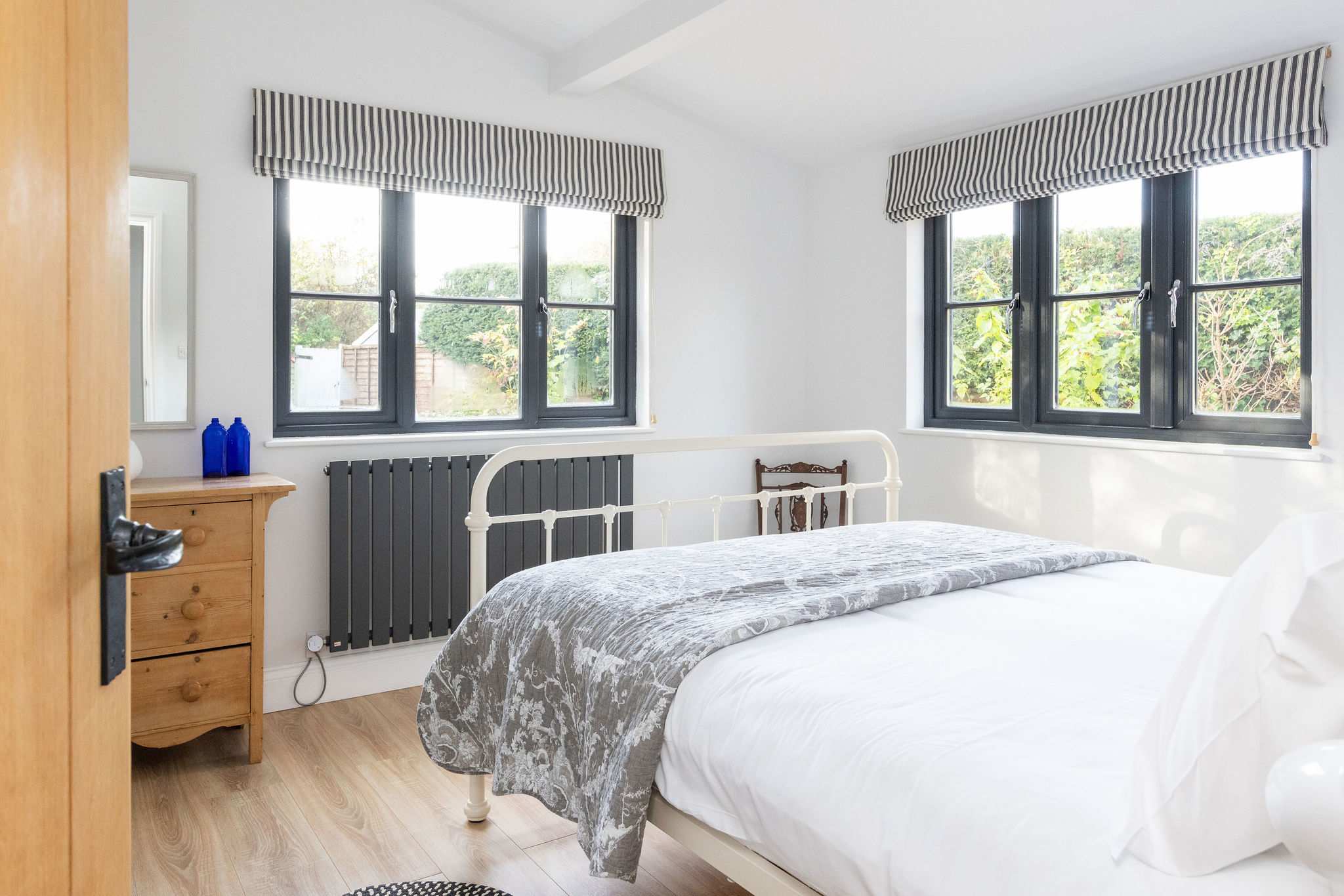 Light-filled bedroom with classic details