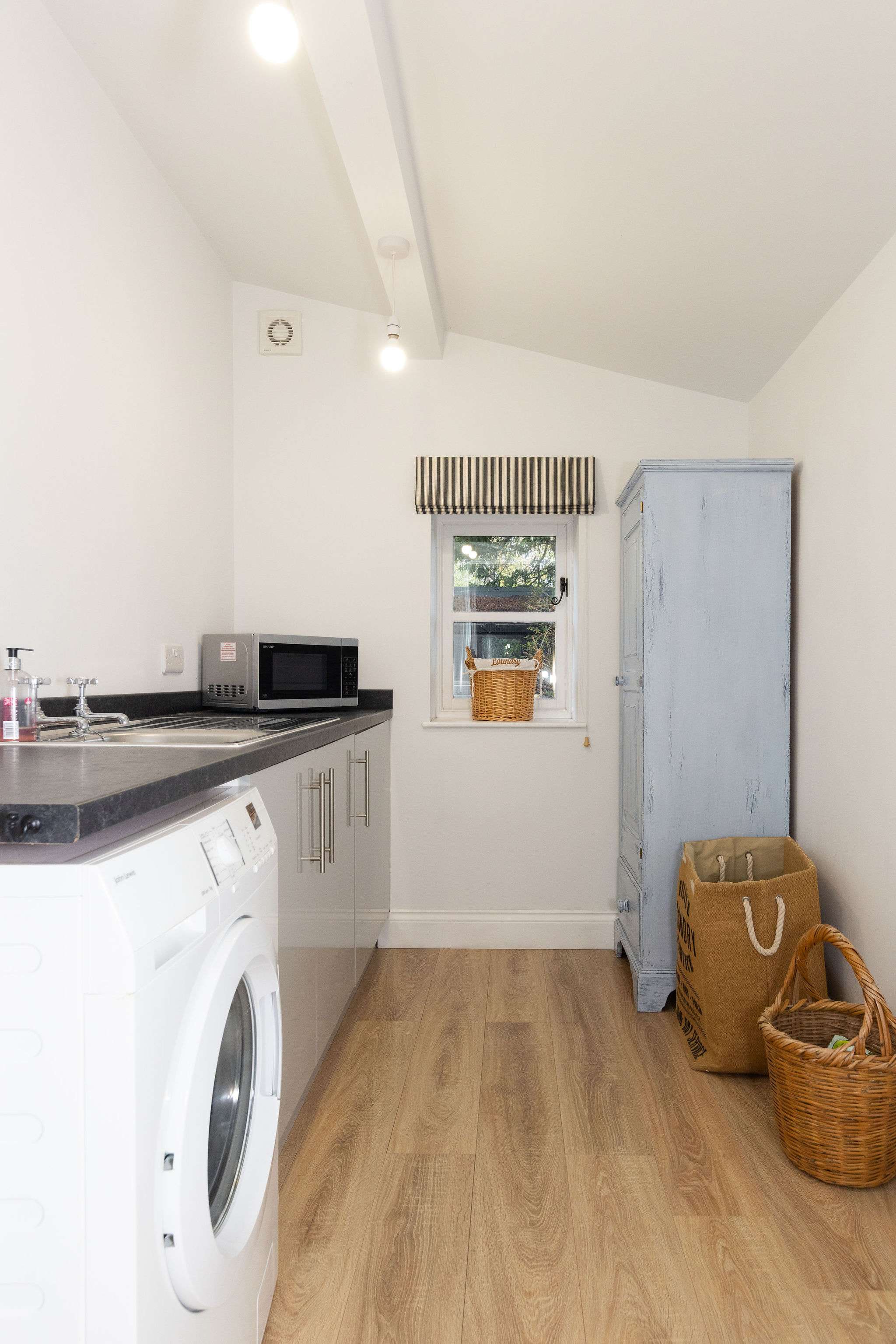 Utility room with washer and sink